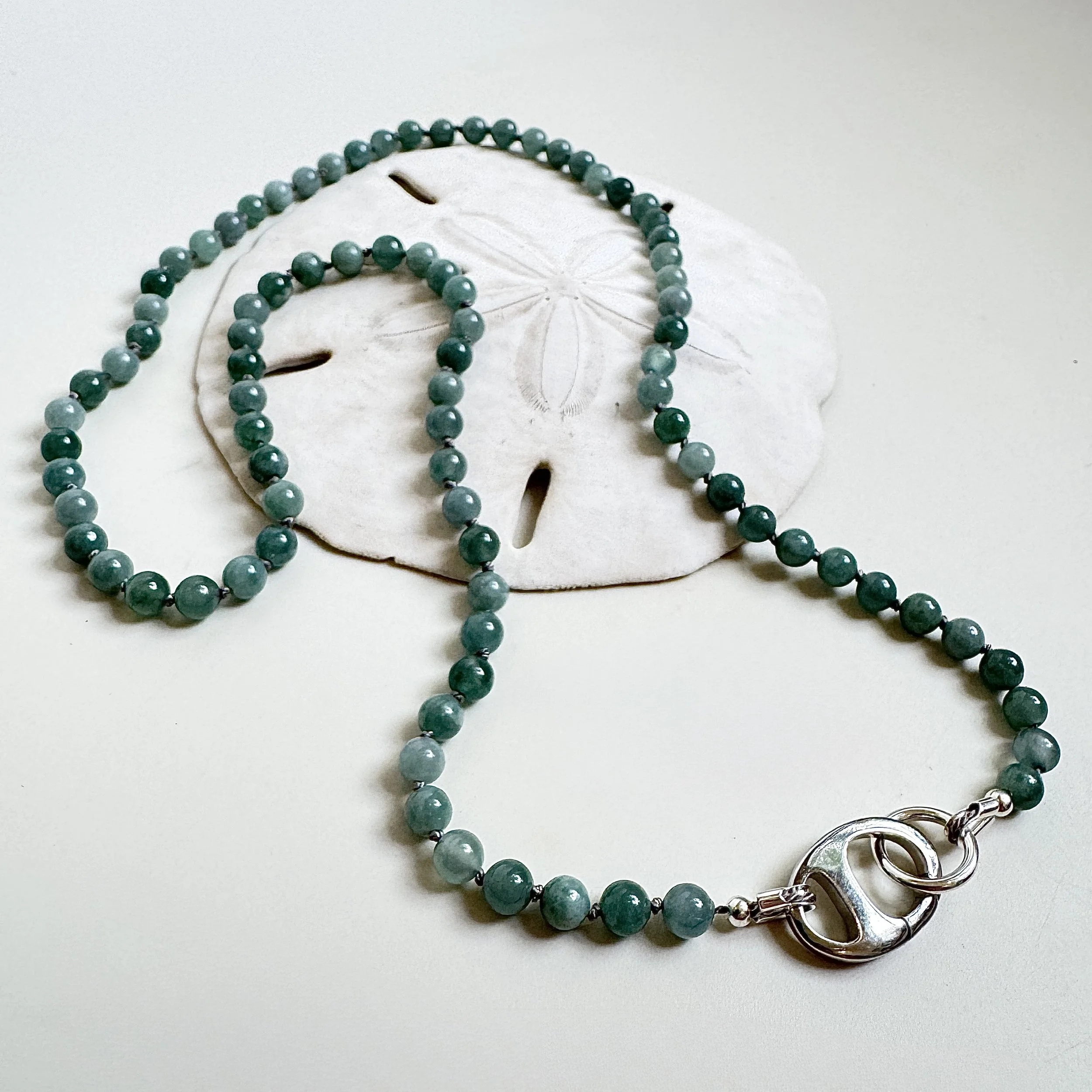 Silk knotted green jade necklace