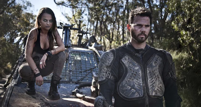 She even car-crouches like a badass. (still courtesy of Guerilla Films)