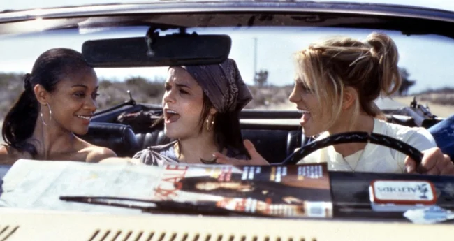 Could there be anything better than a road trip with your best gals and some rando guy sleeping in the back seat? Nope. (Still courtesy of Paramount)