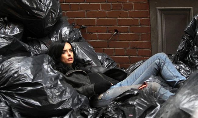 Krysten Ritter makes lying in trash look good. 