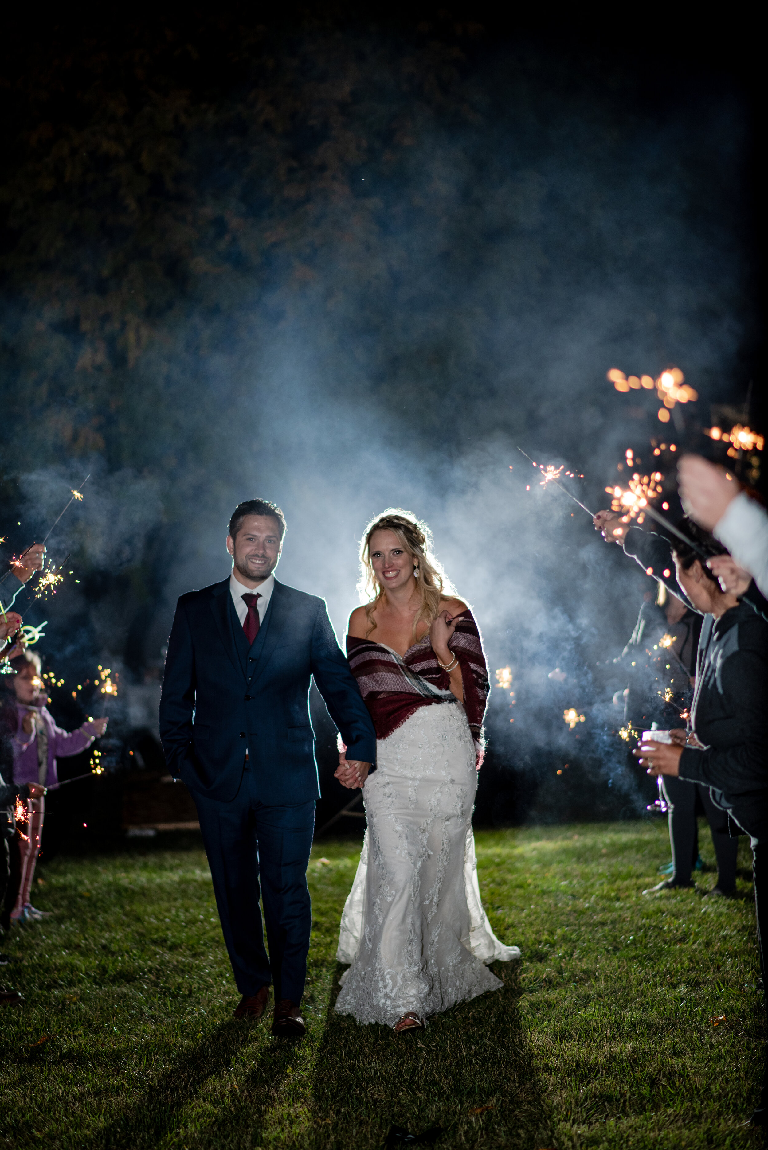 Walk through sparklers in evening wedding reception - eTangPhotography.com
