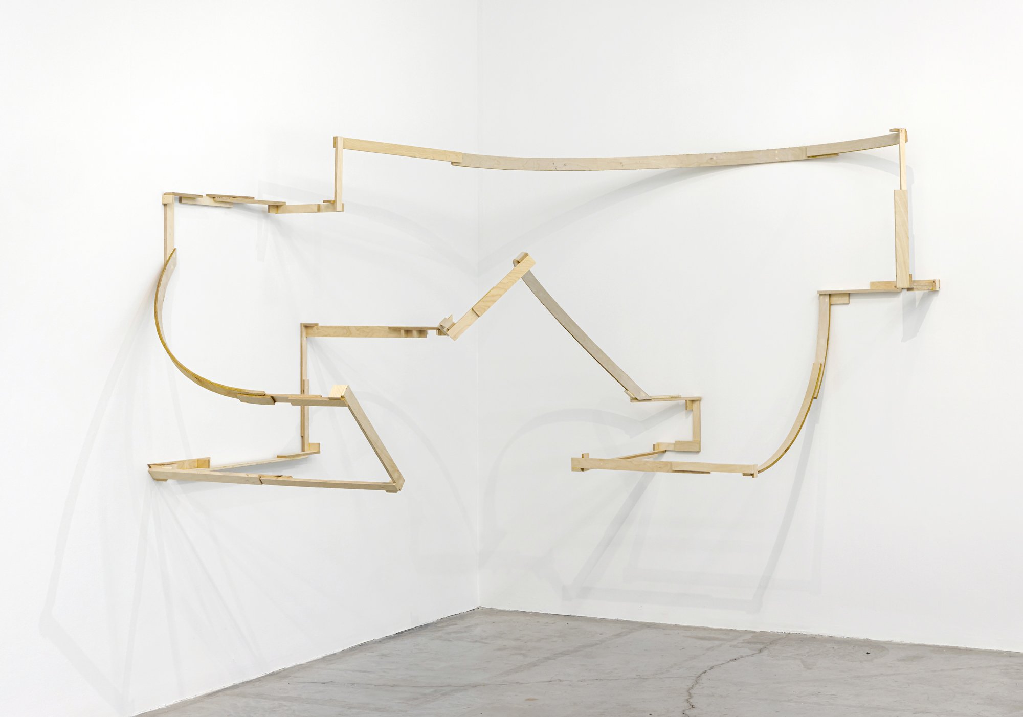   Outline 1 , 2023, site-specific installation, plywood and glue, 59 x 141 x 105 