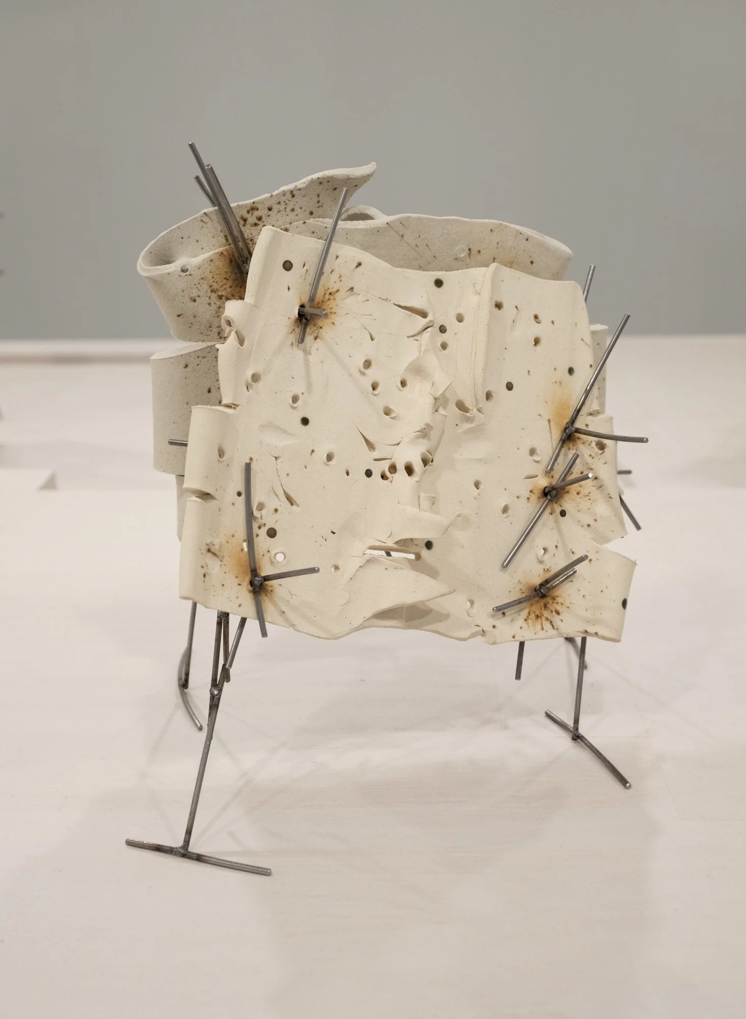   Dancers 5 , 2025, ceramic with glaze details and welded steel, 13h x 14 x 12 in   Courtyard , 2026, Site-Service, Nine, New York 