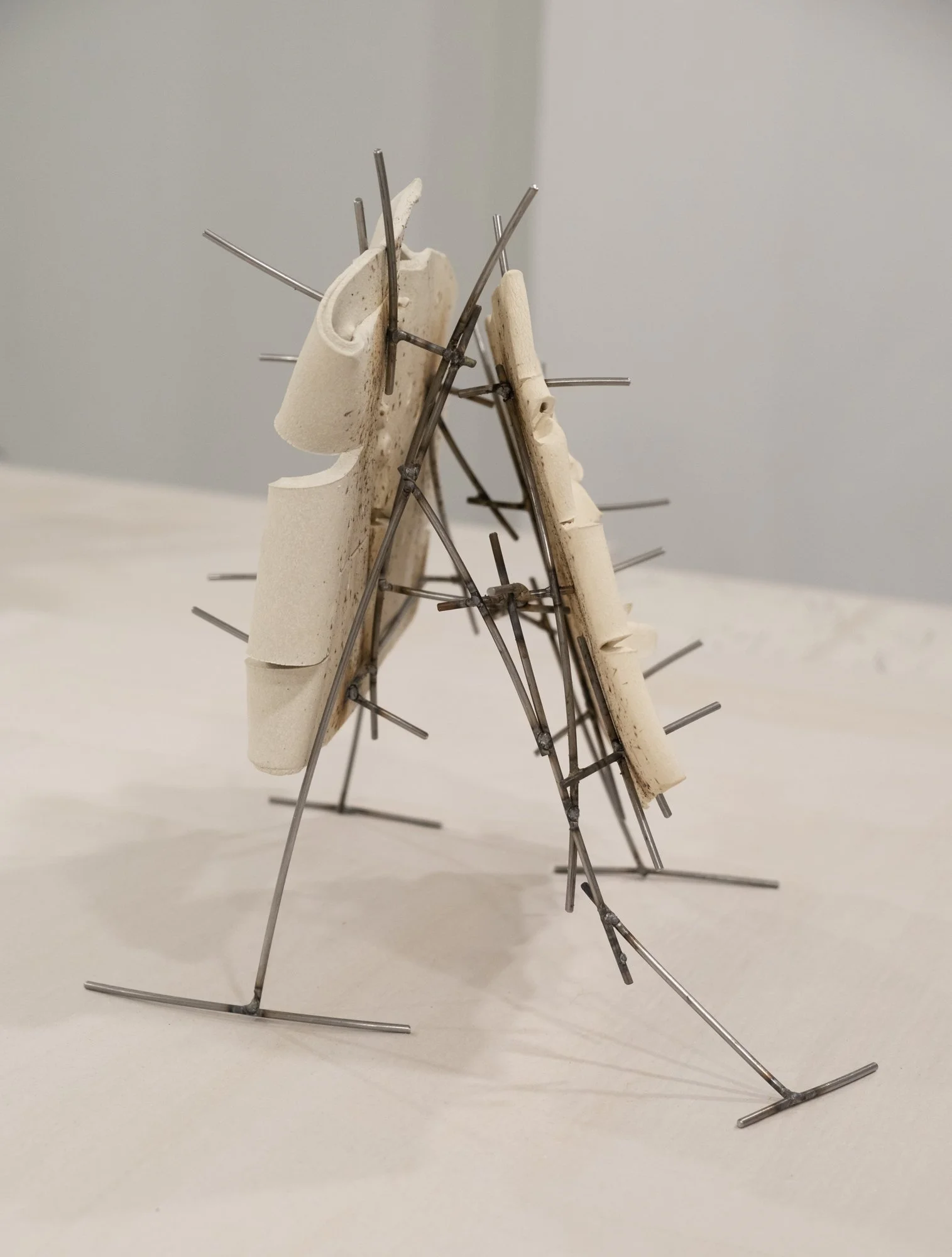   Dancers 5 , 2025, ceramic with glaze details and welded steel, 13h x 14 x 12 in   Courtyard , 2026, Site-Service, Nine, New York 