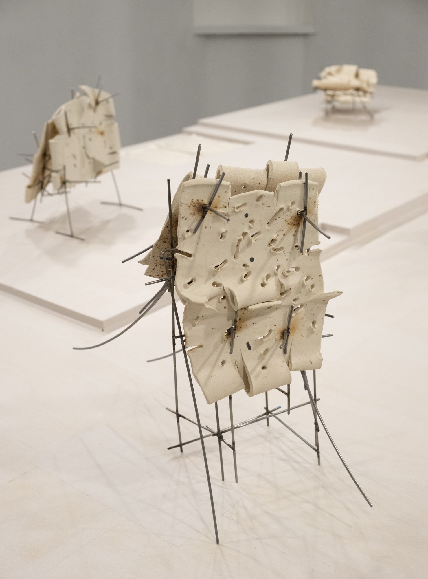   Dancers 6 , 2025, ceramic with glaze details and welded steel, 17h x 18 x 10in   Courtyard , 2026, Site-Service, Nine, New York 