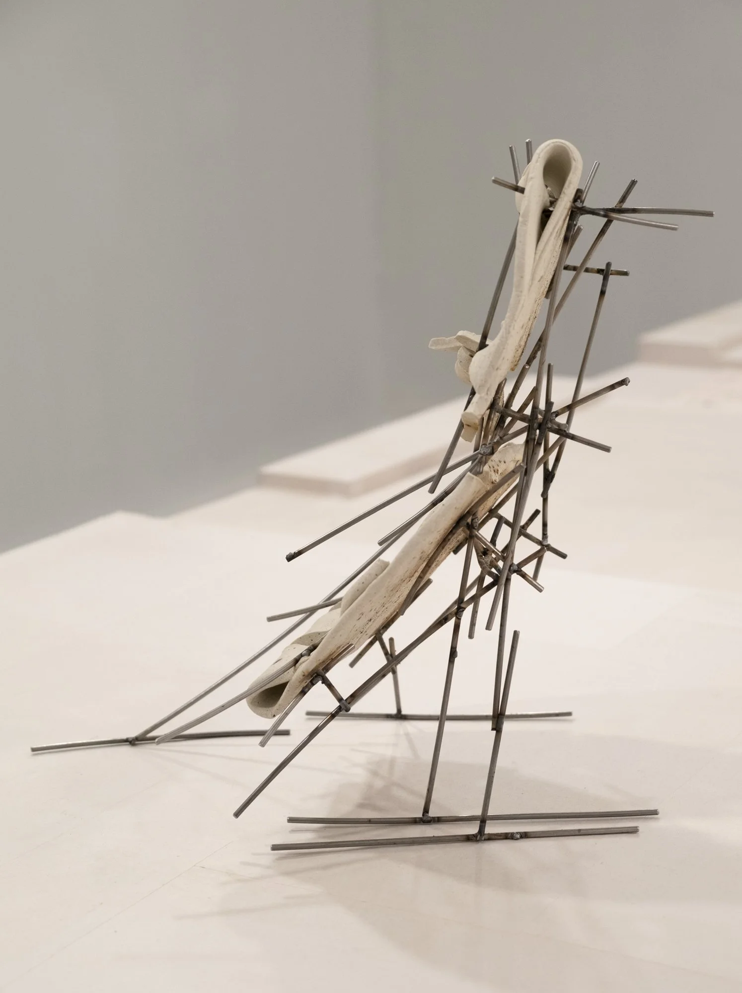   Dancers 7 , 2025, ceramic with glaze details and welded steel, 14h x 8 x 12in   Courtyard , 2026, Site-Service, Nine, New York 