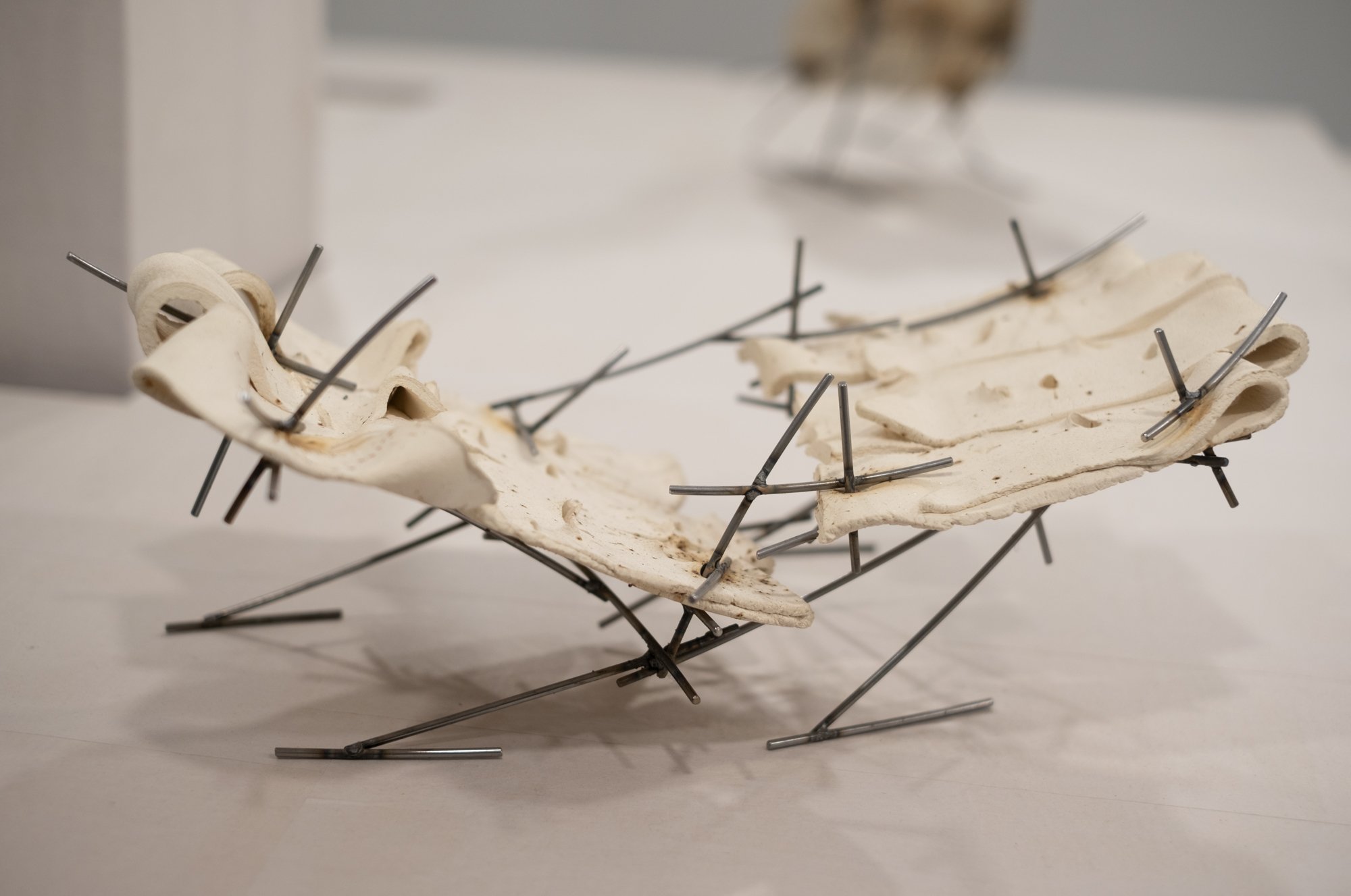   Dancers 8 , 2025, ceramic with glaze details and welded steel, 7h x 16 x 10in   Courtyard , 2026, Site-Service, Nine, New York 