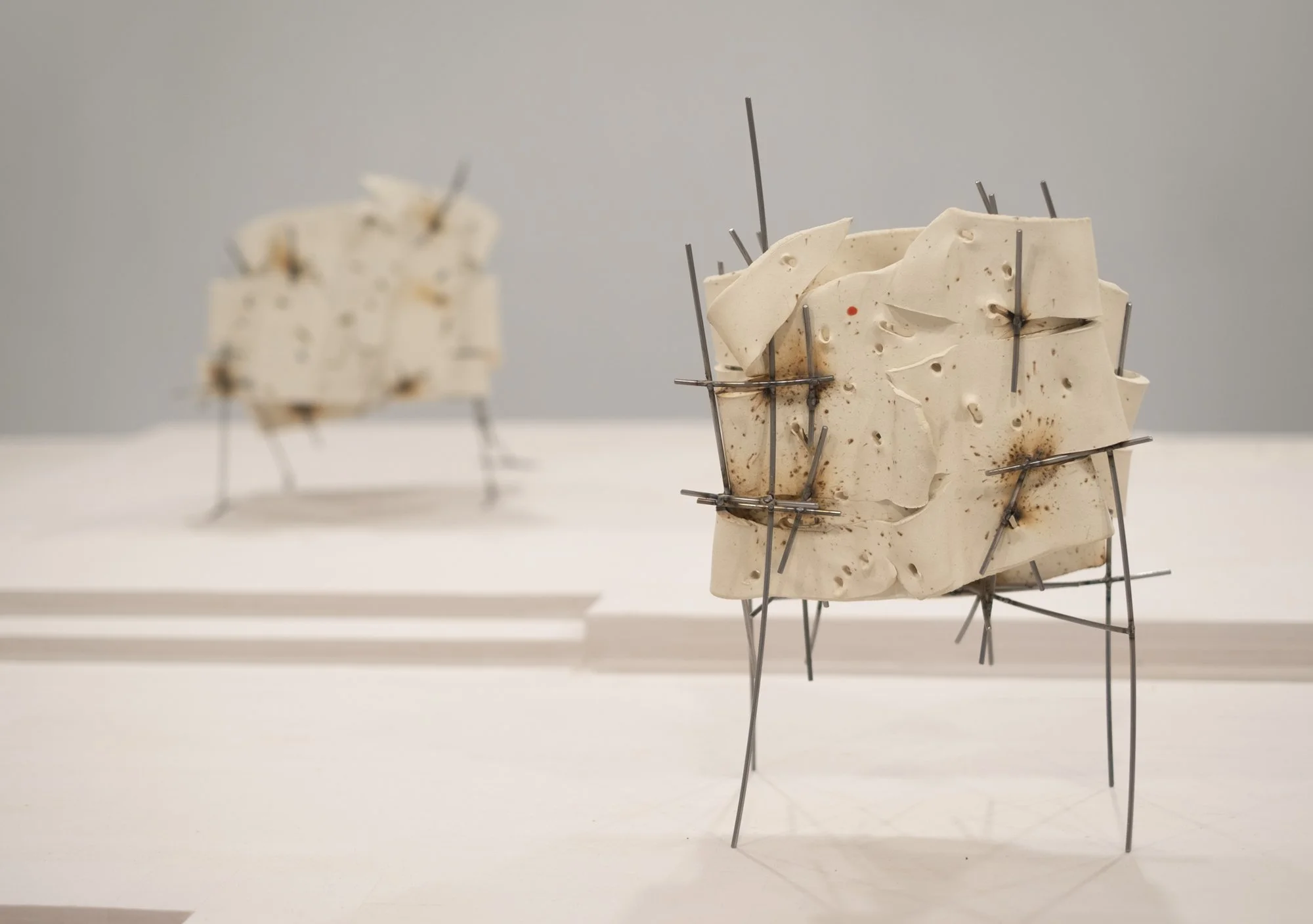   Dancers 9 , 2025, ceramic with glaze details and welded steel, 16h x 11 x 7in   Courtyard , 2026, Site-Service, Nine, New York 