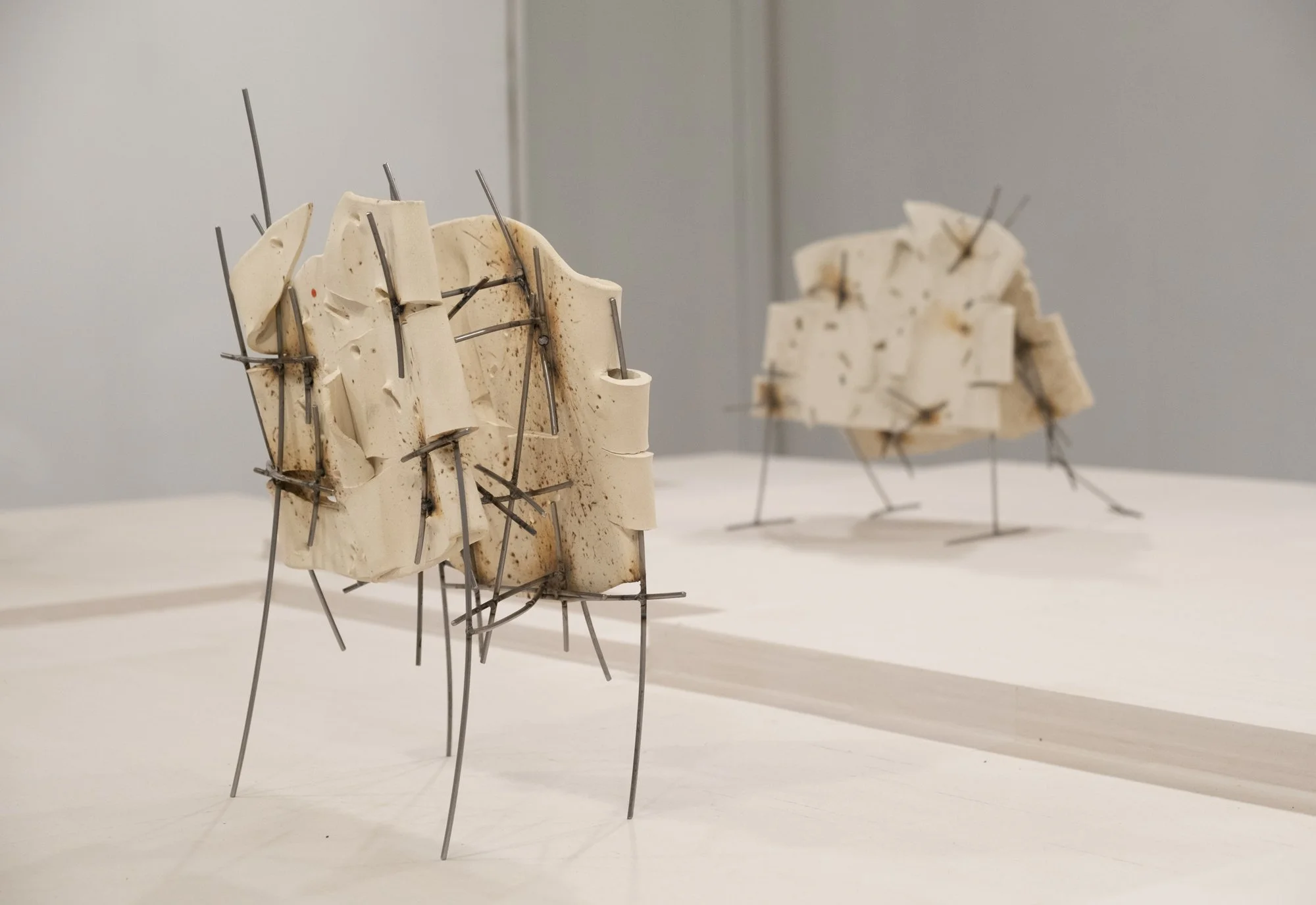   Dancers 9 , 2025, ceramic with glaze details and welded steel, 16h x 11 x 7in   Courtyard , 2026, Site-Service, Nine, New York 