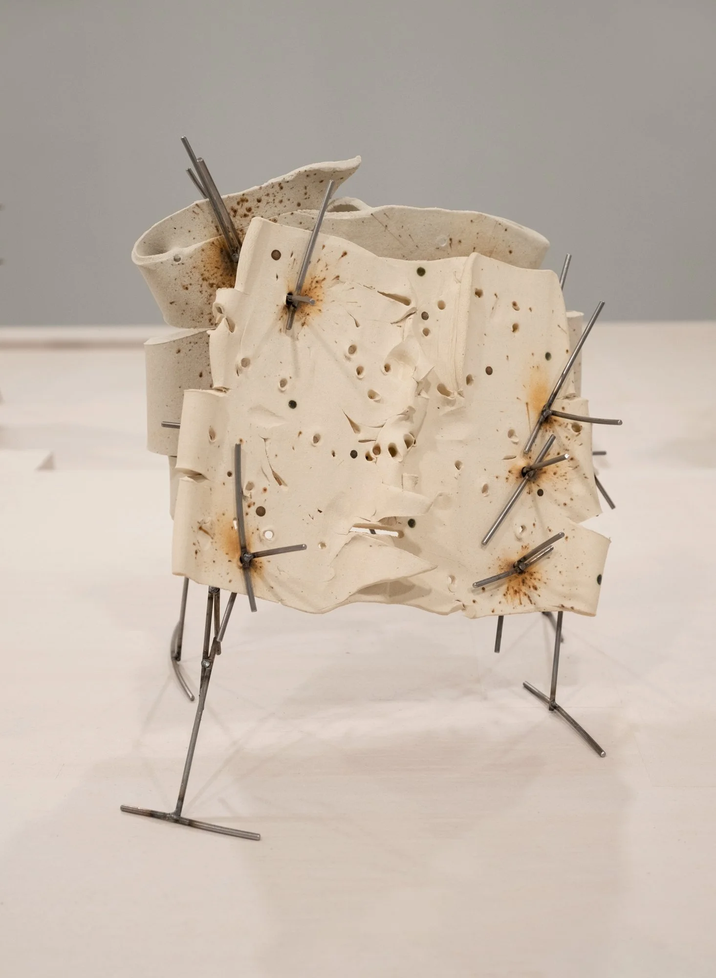   Dancers 5 , 2025, ceramic with glaze details and welded steel, 13h x 14 x 12 in   Courtyard , 2026, Site-Service, Nine, New York 