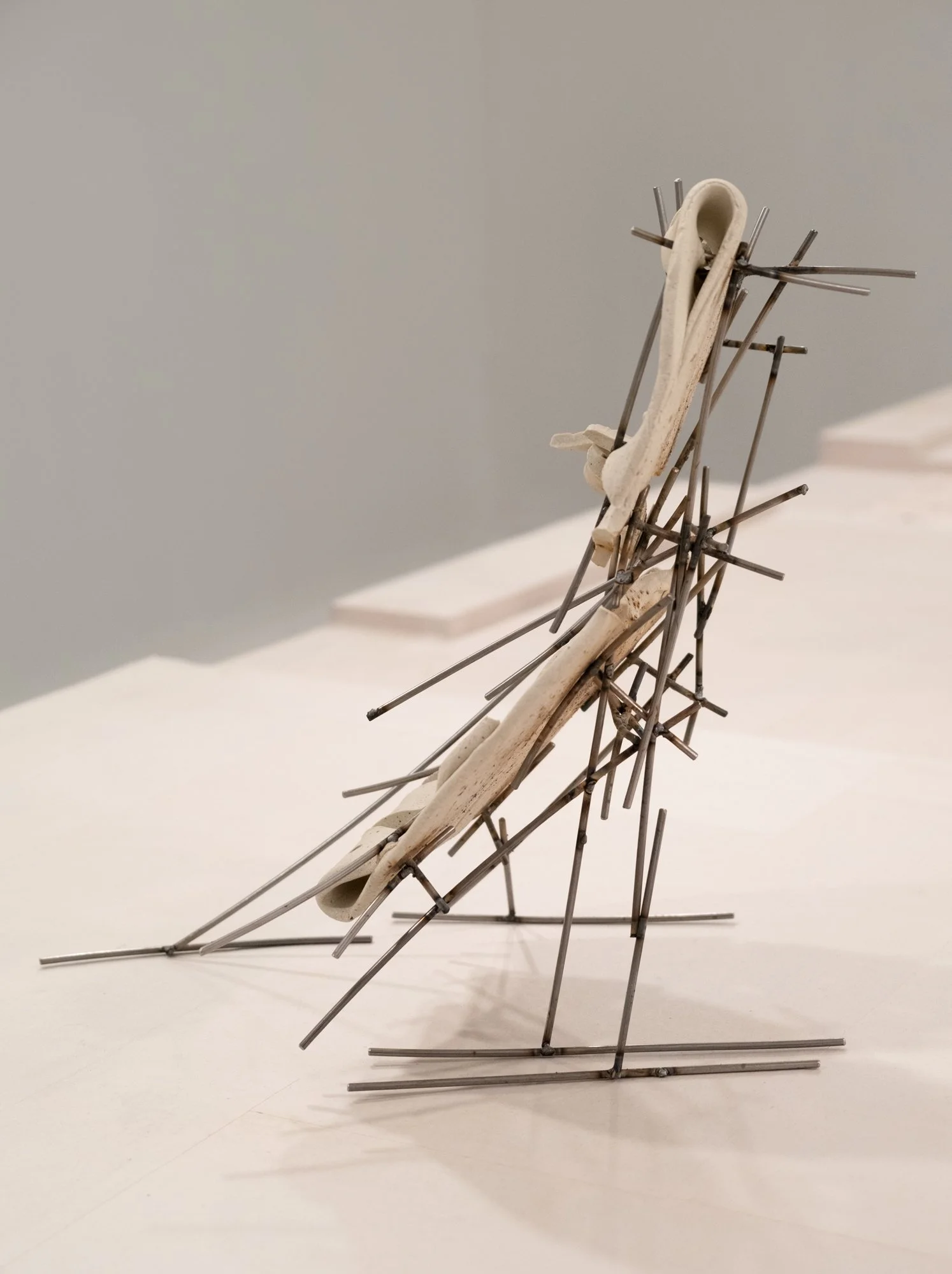   Dancers 7 , 2025, ceramic with glaze details and welded steel, 14h x 8 x 12in   Courtyard , 2026, Site-Service, Nine, New York 