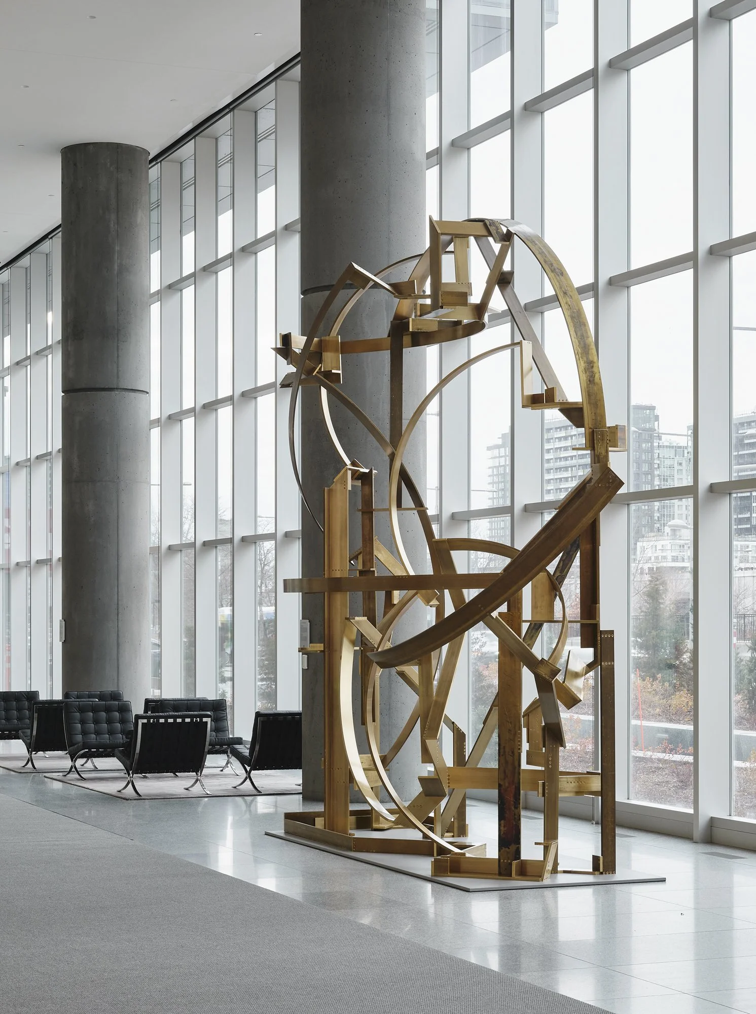   Presque vu , 2023, architectural bronze bar and brass-plated hardware, 180 x 144 x 60 in  Banque Nationale, Montréal, Canada  Photo by Maxime Brouillet 