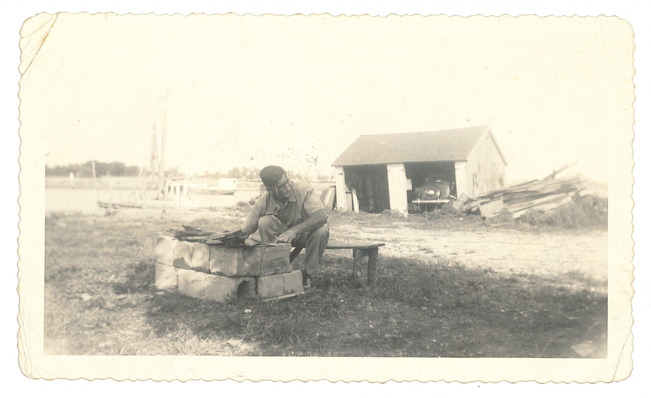 Unidentified Man Lighting a Fire, ca. 1950