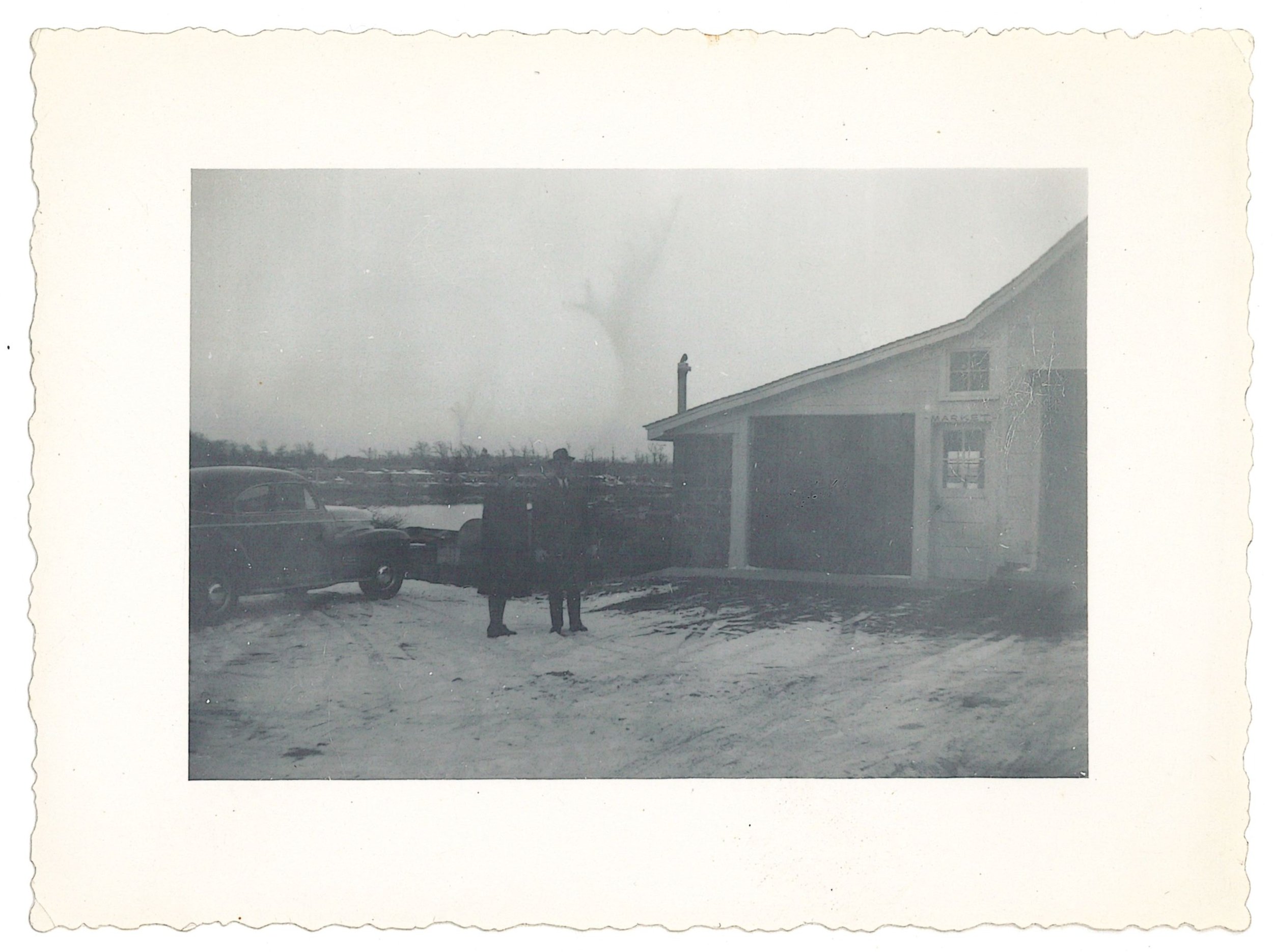 Unidentified Couple Outside Pell's Fish Market, ca. 1950