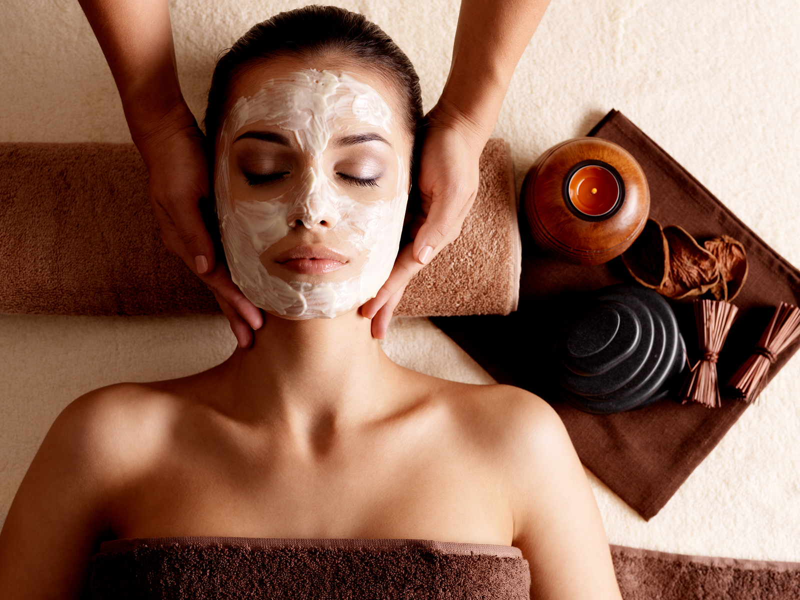 Bigstock-43524497-Spa-massage-for-young-woman-with-facial-mask-on-face-indoors.jpg