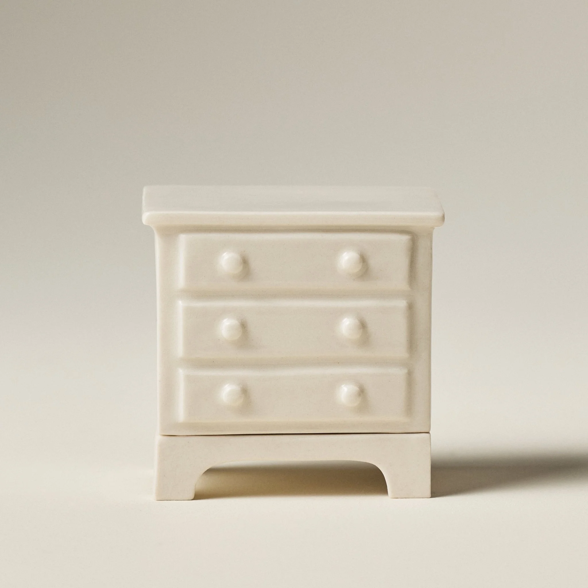 Miniature ceramic dresser match holder and striker in a creamy Natural clay with gloss glaze, drawers closed