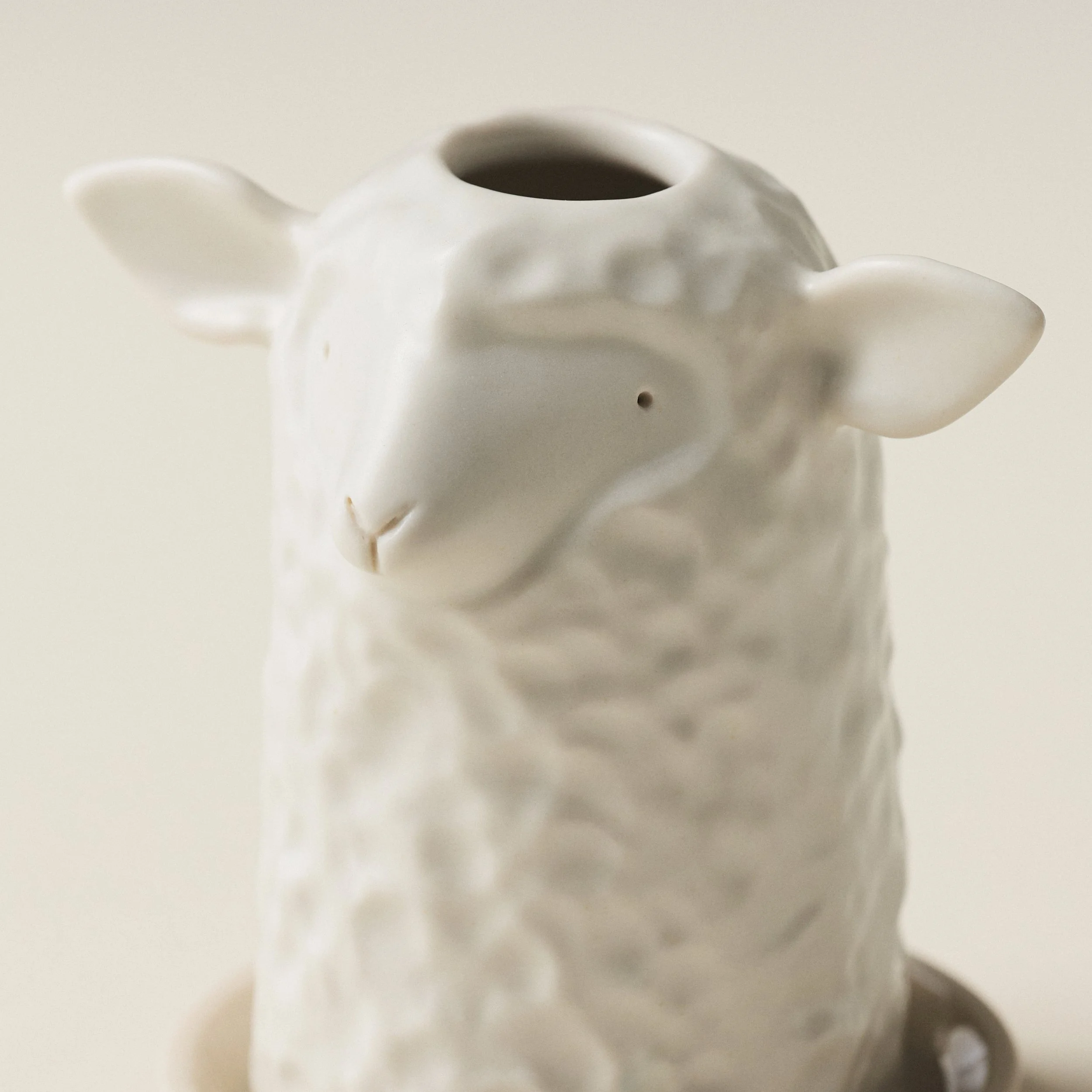Close-up detail of the PetitFelts Herschel toothbrush holder's face and ears