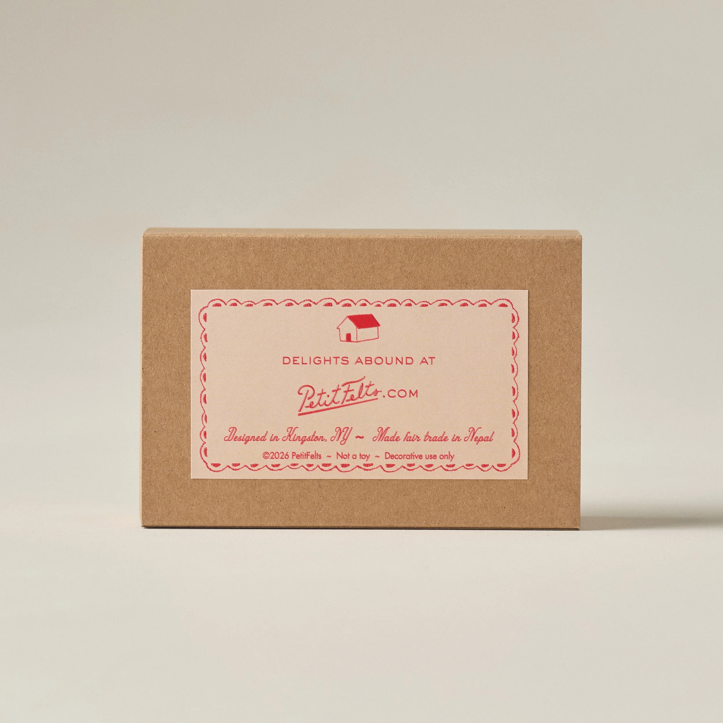 Back of PetitFelts Cocktail Shrimp ornament set box displaying raised ink label