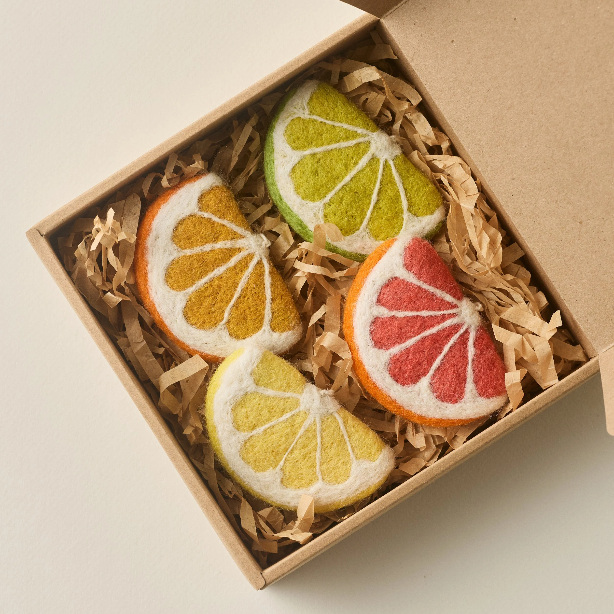 PetitFelts Citrus citrus ornaments, including lemon, lime, orange and grapefruit slice