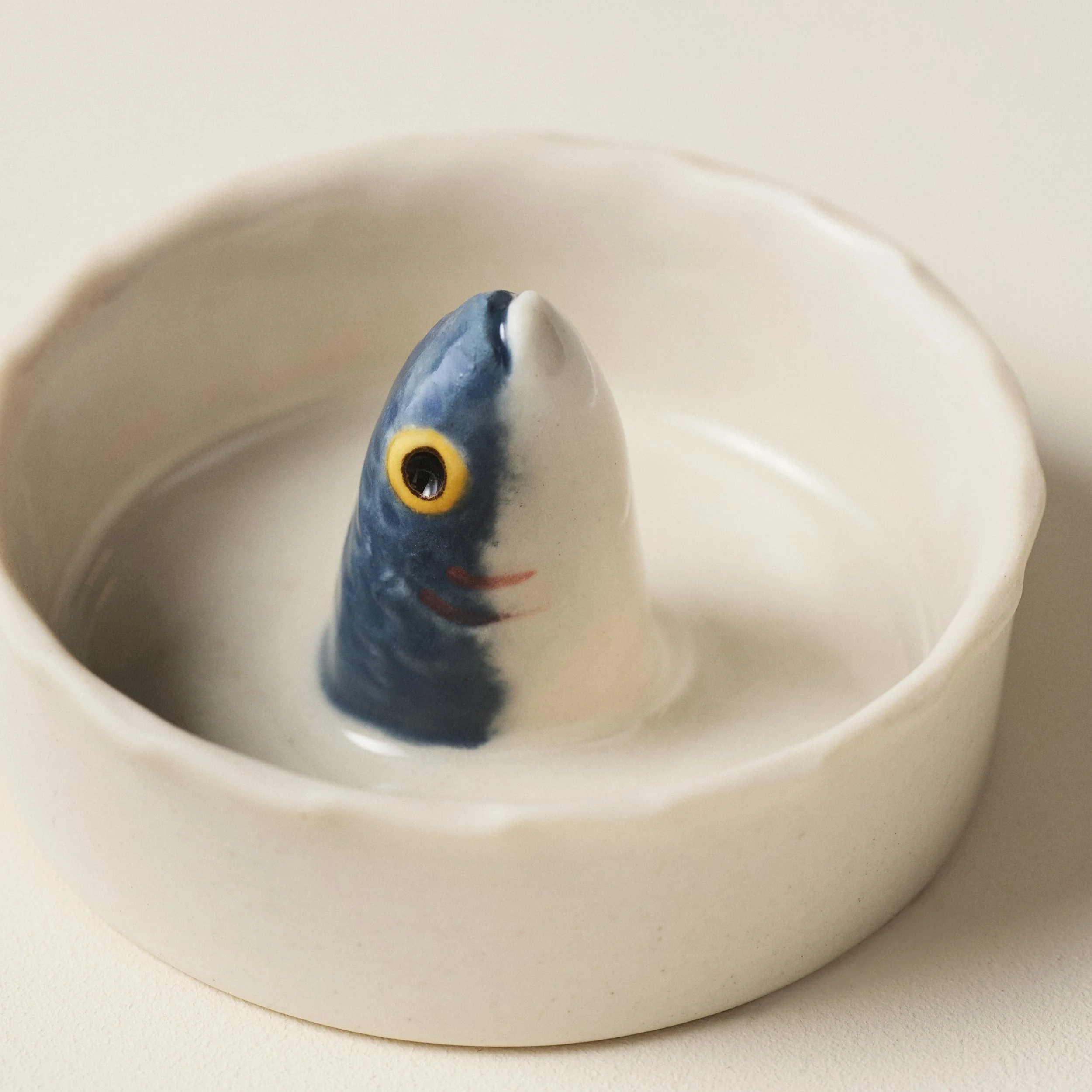 Overhead view of the PetitFelts Julian Head ceramic salt dish