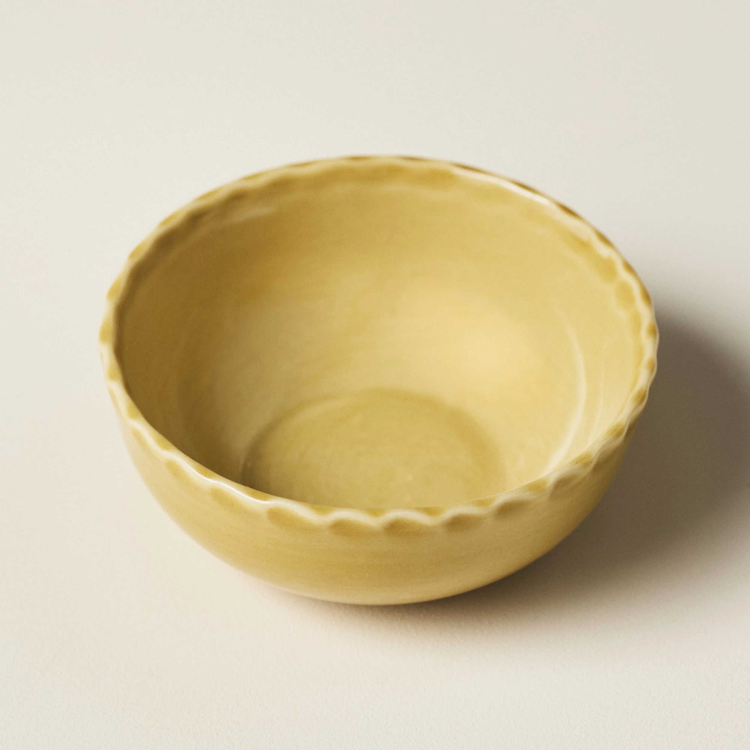 Overhead view of the PetitFelts Fennel small ceramic bowl's glazed interior