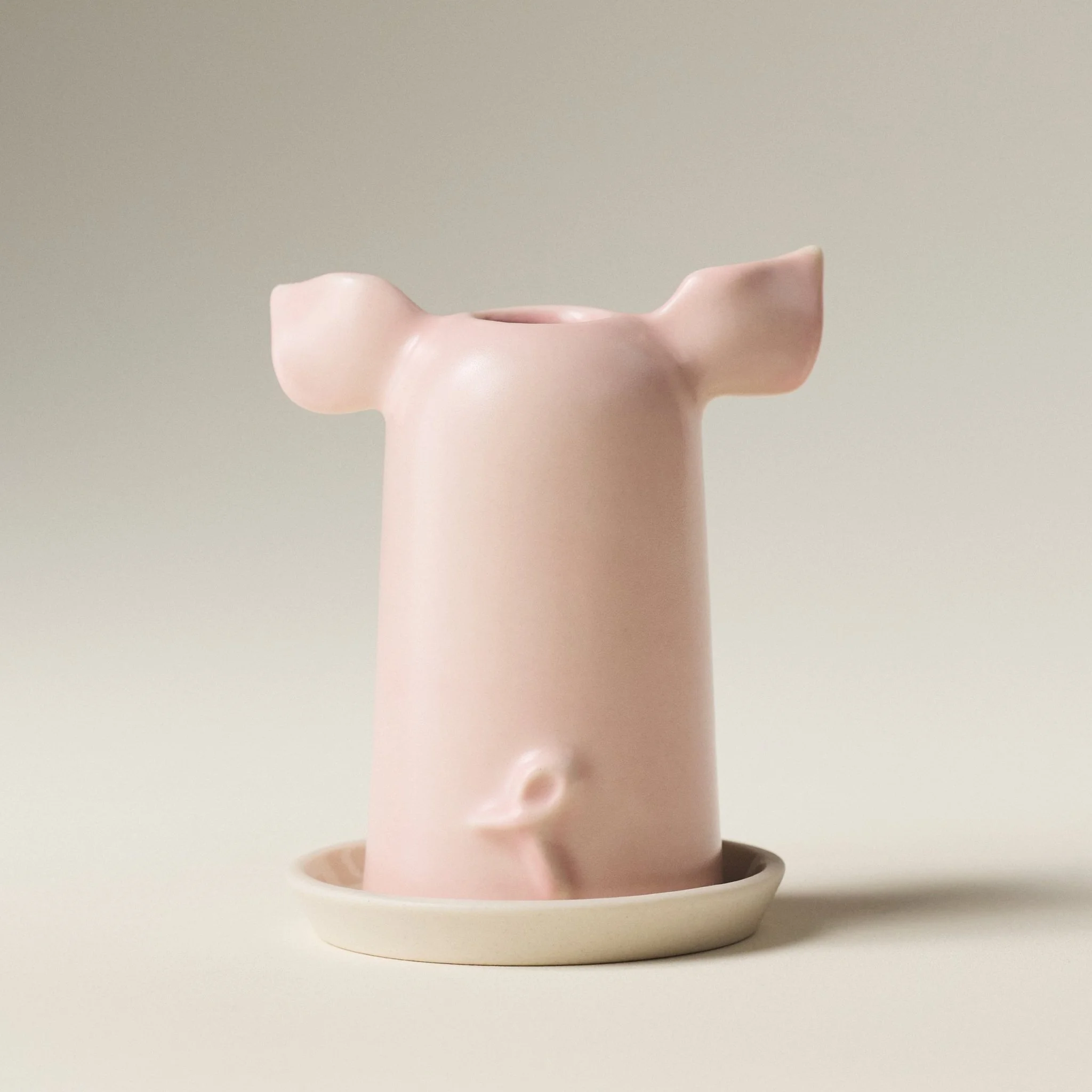 Back angle of the PetitFelts Rose toothbrush holder showing its curled tail