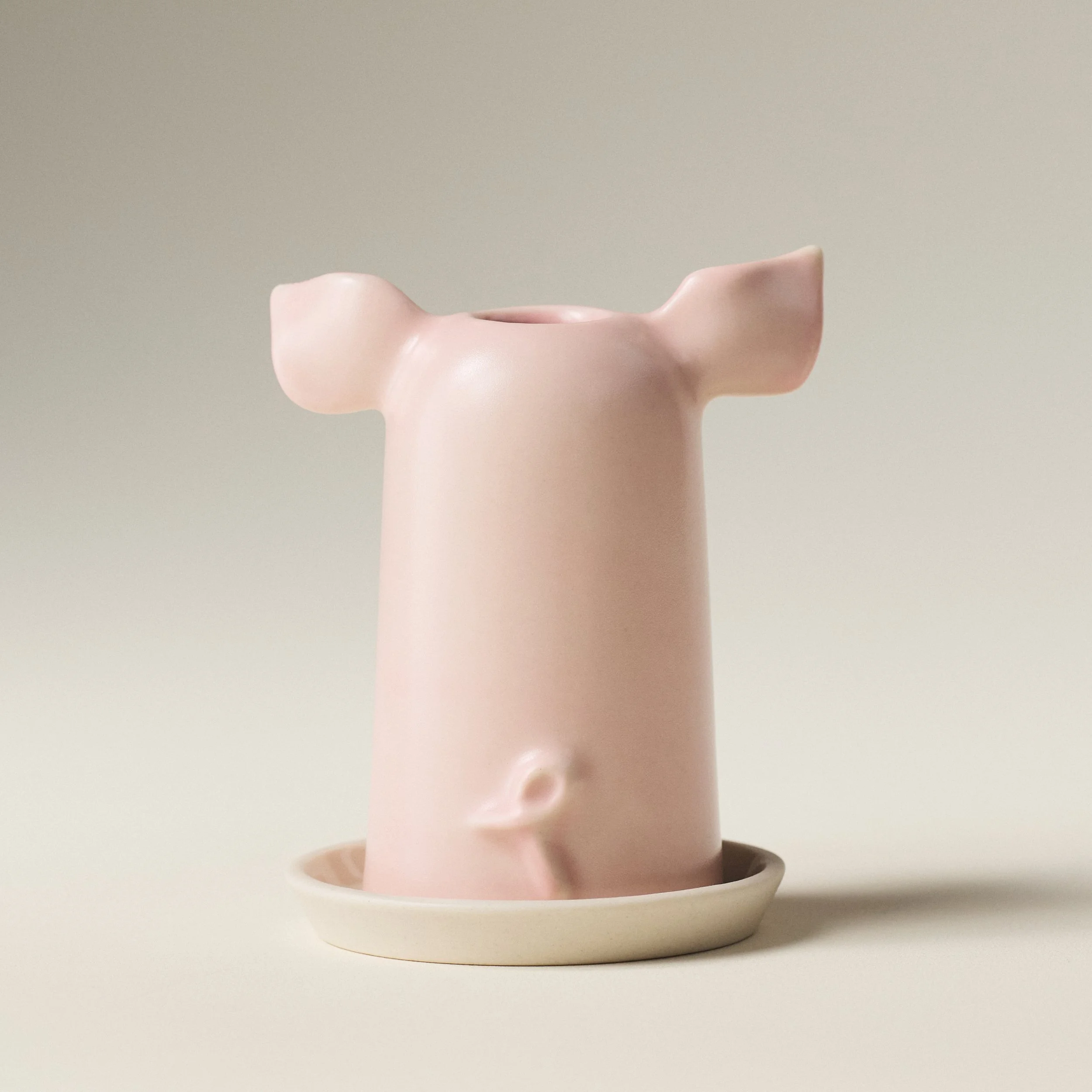 Back angle of the PetitFelts Rose toothbrush holder showing its curled tail