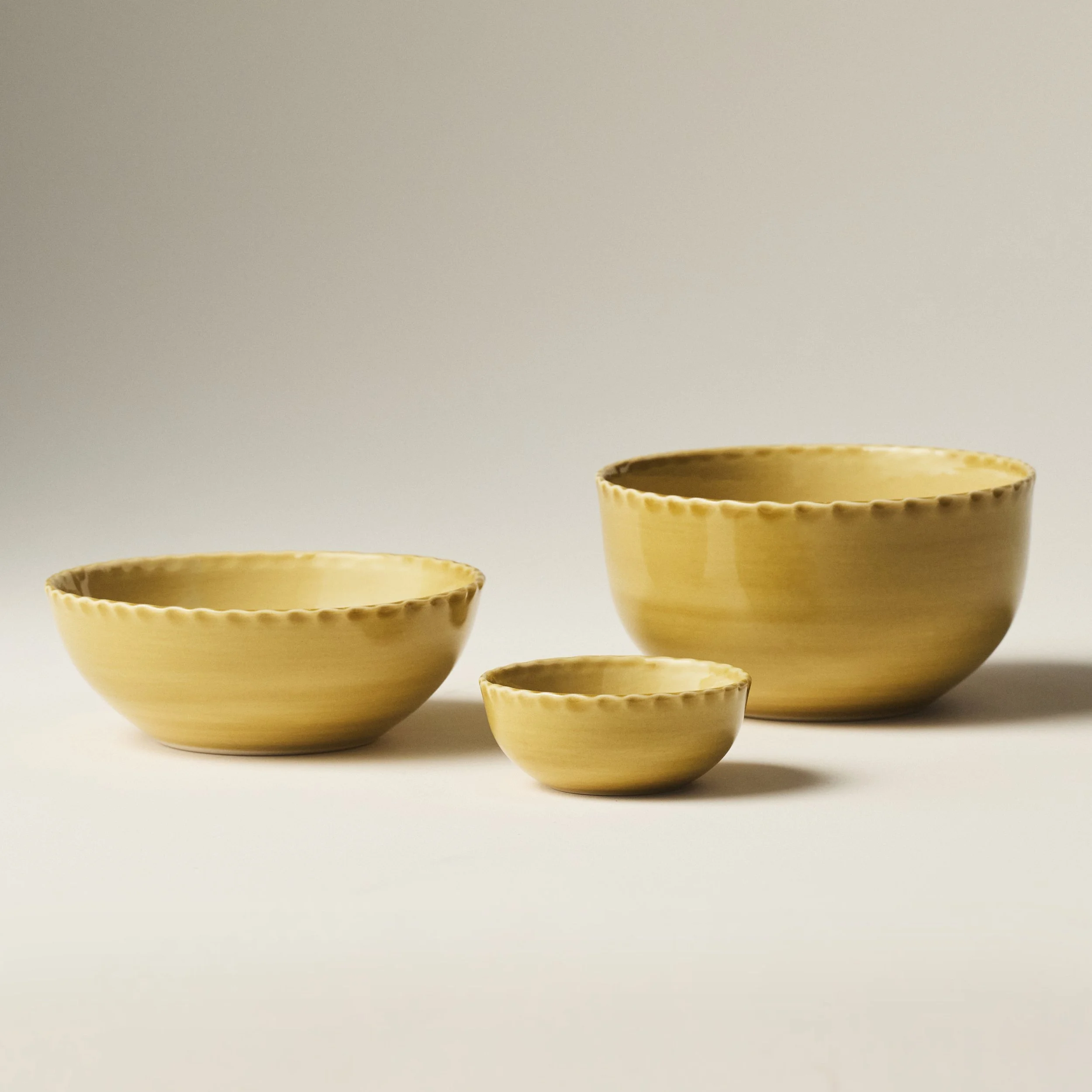 PetitFelts Fennel ceramic bowls shown together in Petite, Soup, and Dinner sizes