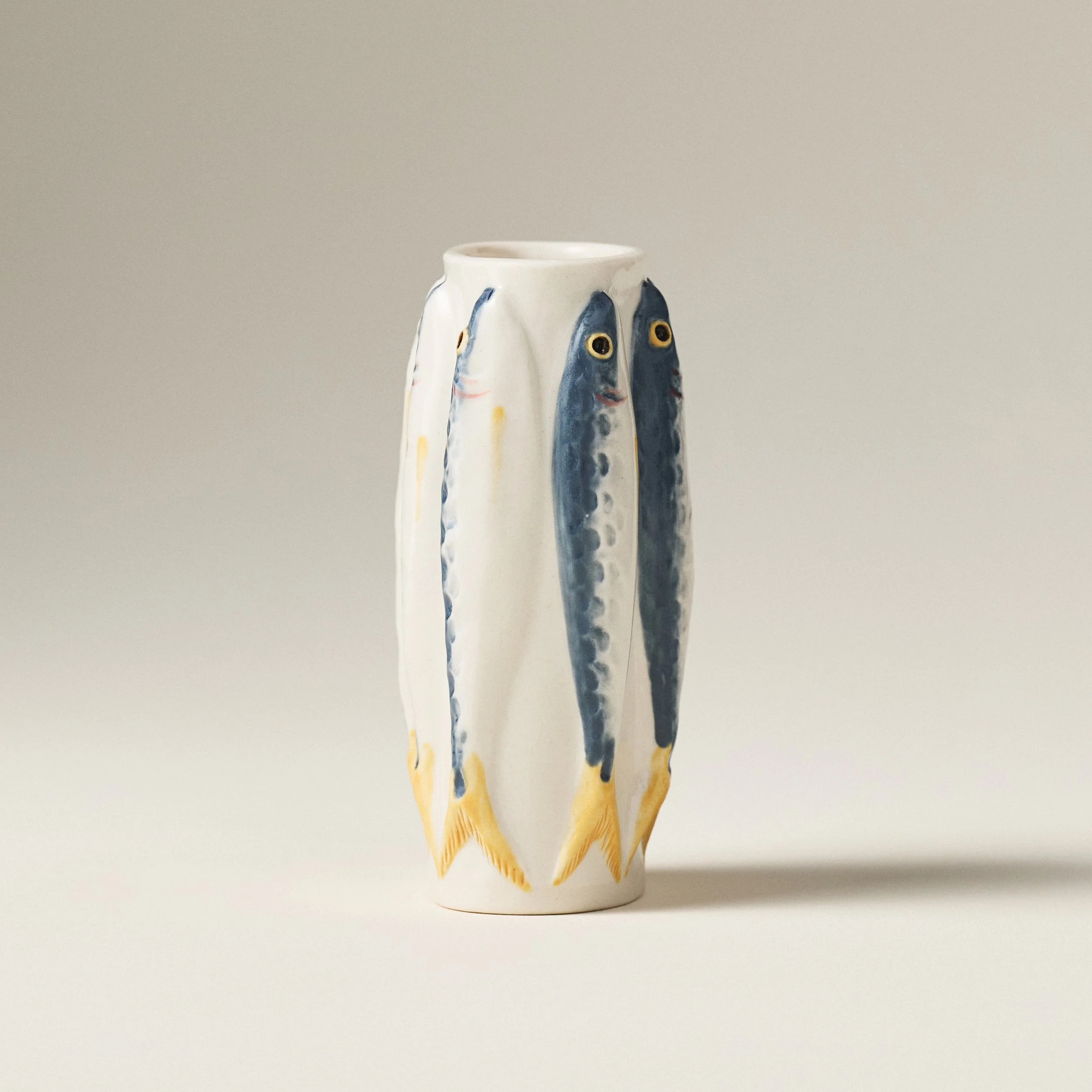 Side view of the PetitFelts Julian sardine vase showing tail detail