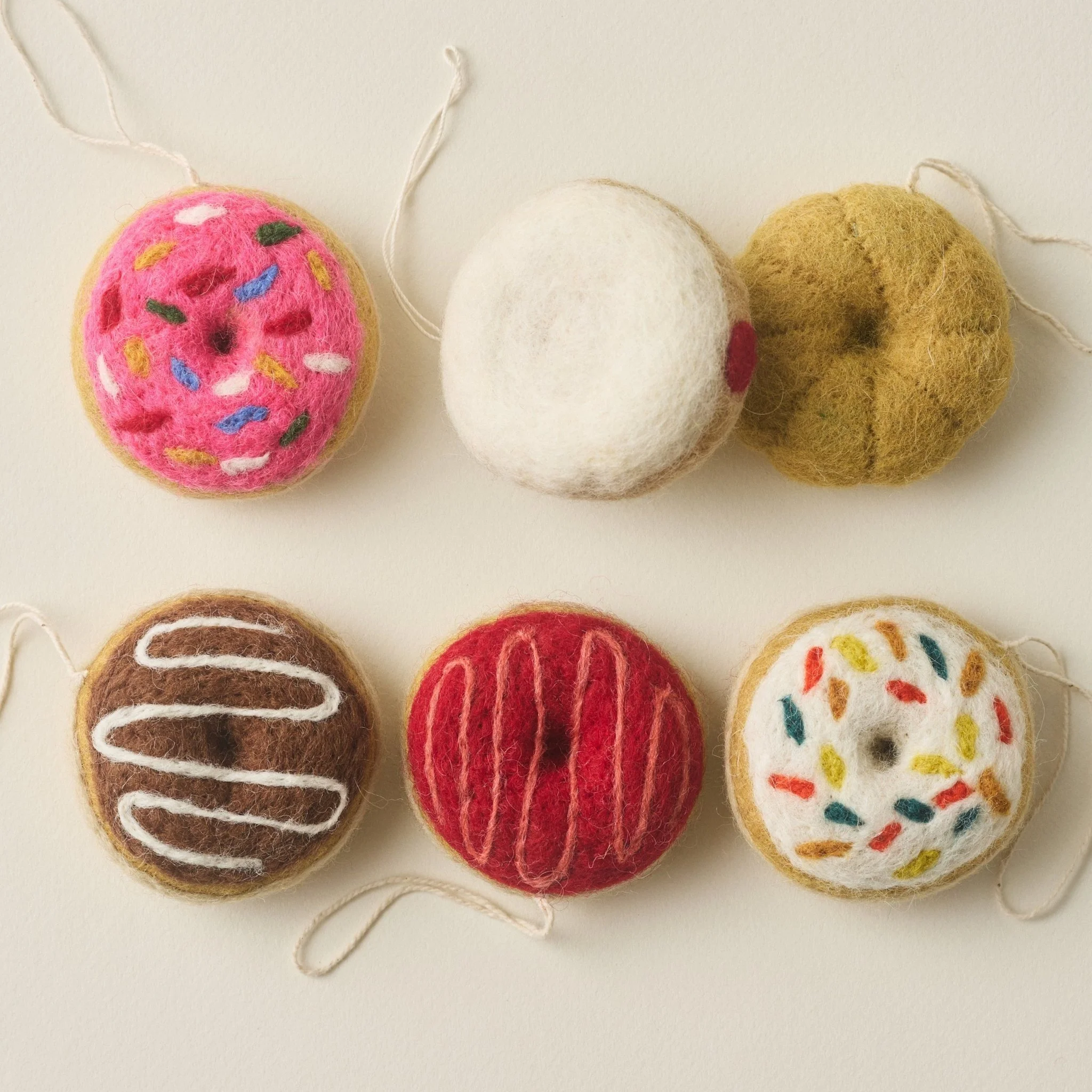 PetitFelts Sprinkle, Jelly, Cruller, Strawberry and Chocolate Donut Ornaments included in the set
