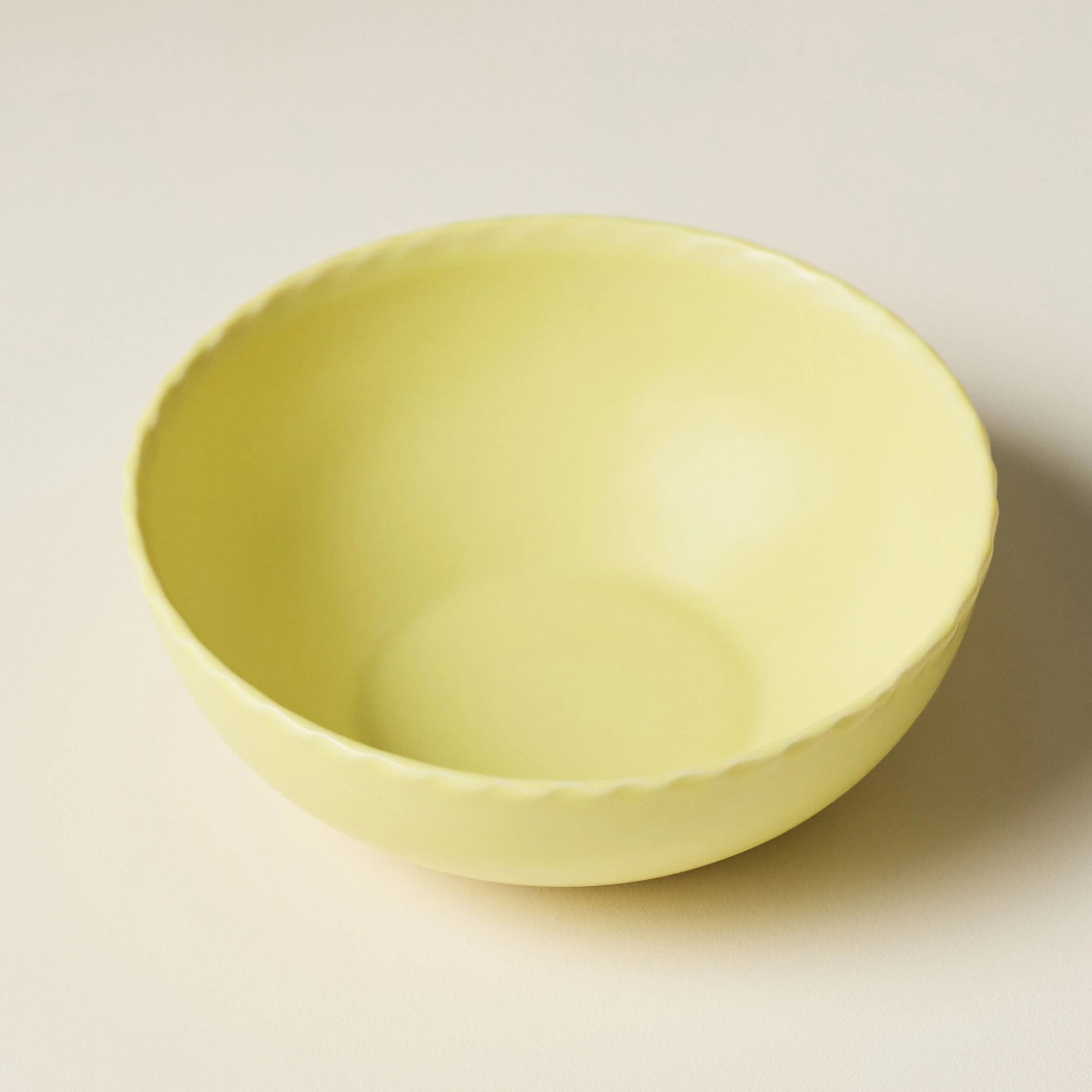 Overhead view of the PetitFelts Custard ceramic soup bowl's glazed interior
