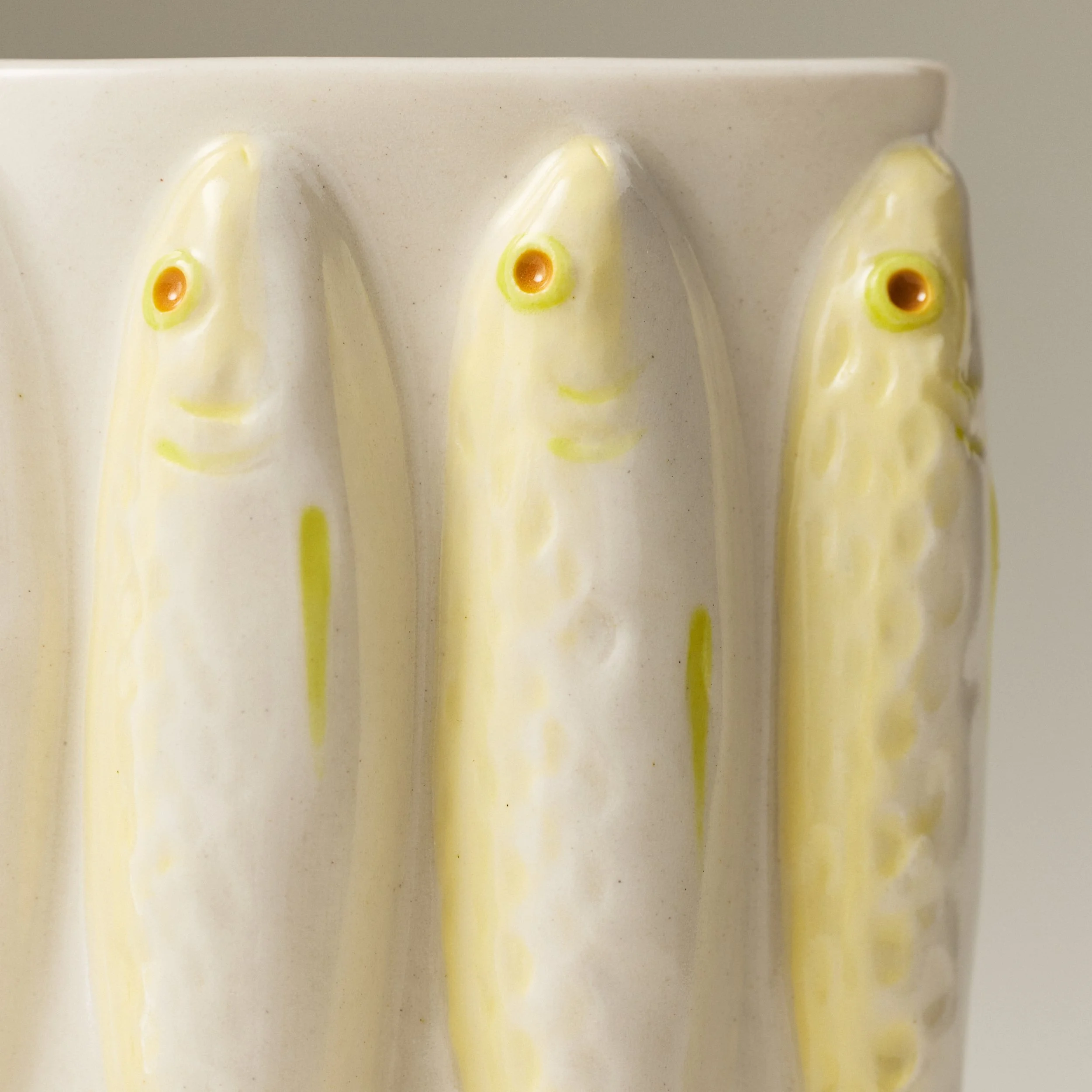 Close up of the sardines on a PetitFelts' Moonflower ceramic vase
