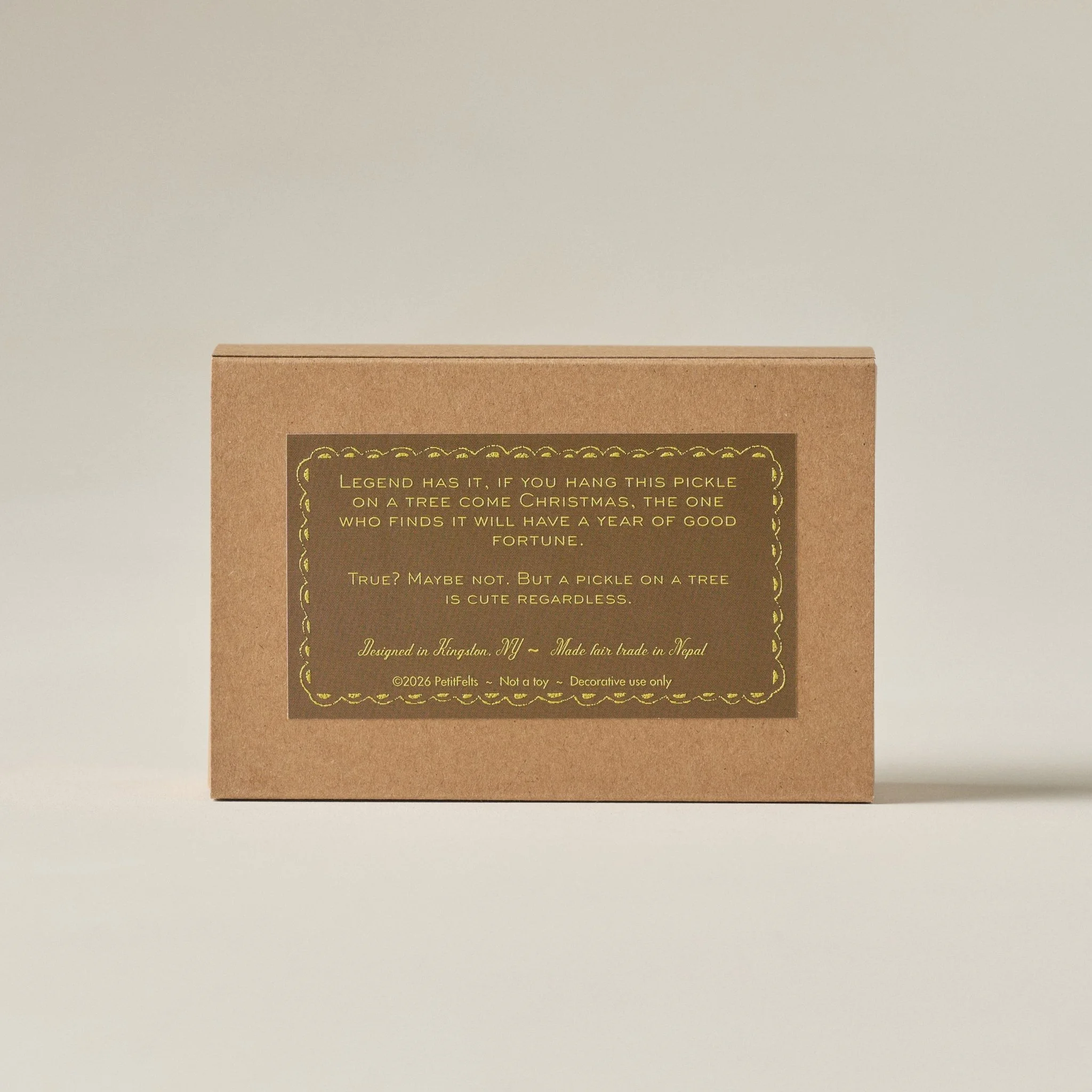 PetitFelts pickle ornament box featuring the story of the Christmas pickle in raised ink