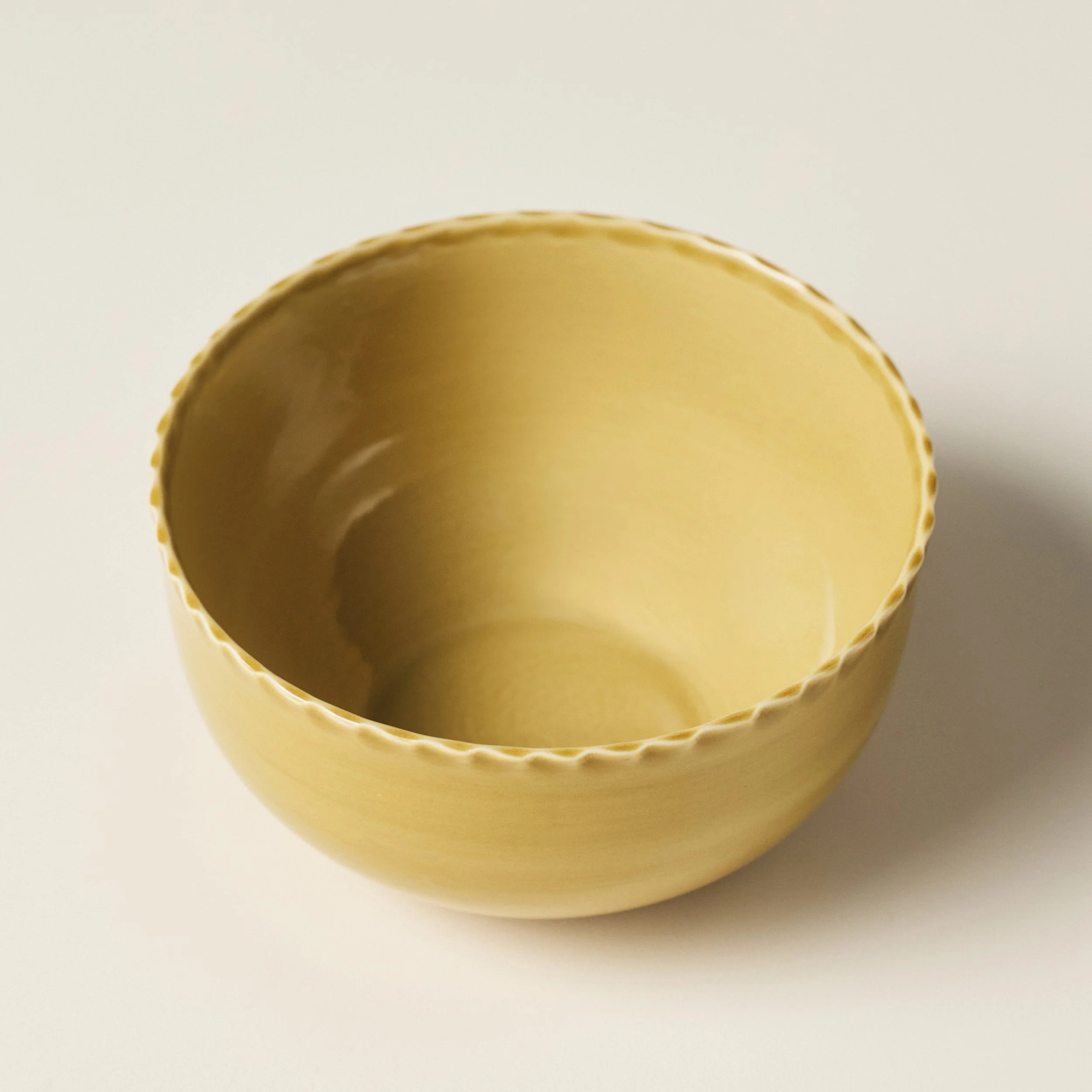 Overhead view of the PetitFelts Fennel ceramic dinner bowl's glazed interior