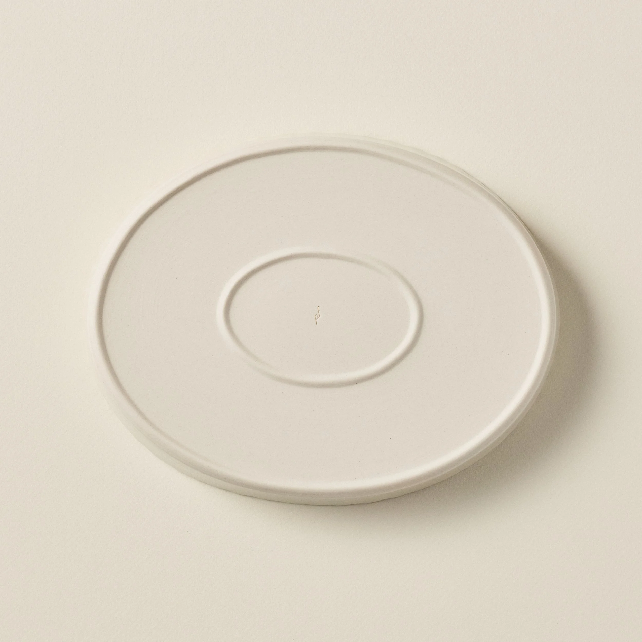 Overhead detail of the PetitFelts Natural ceramic platter