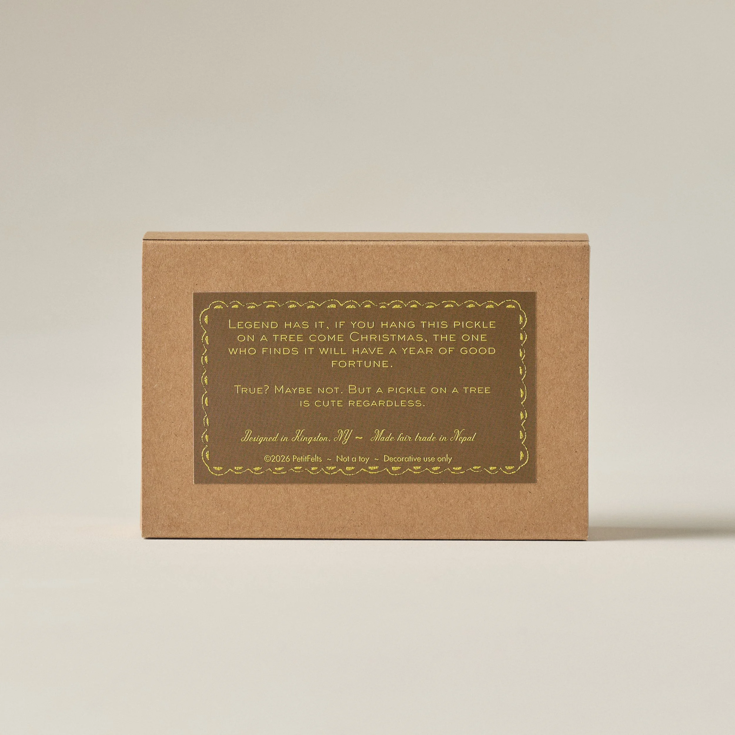 PetitFelts pickle ornament box featuring the story of the Christmas pickle in raised ink