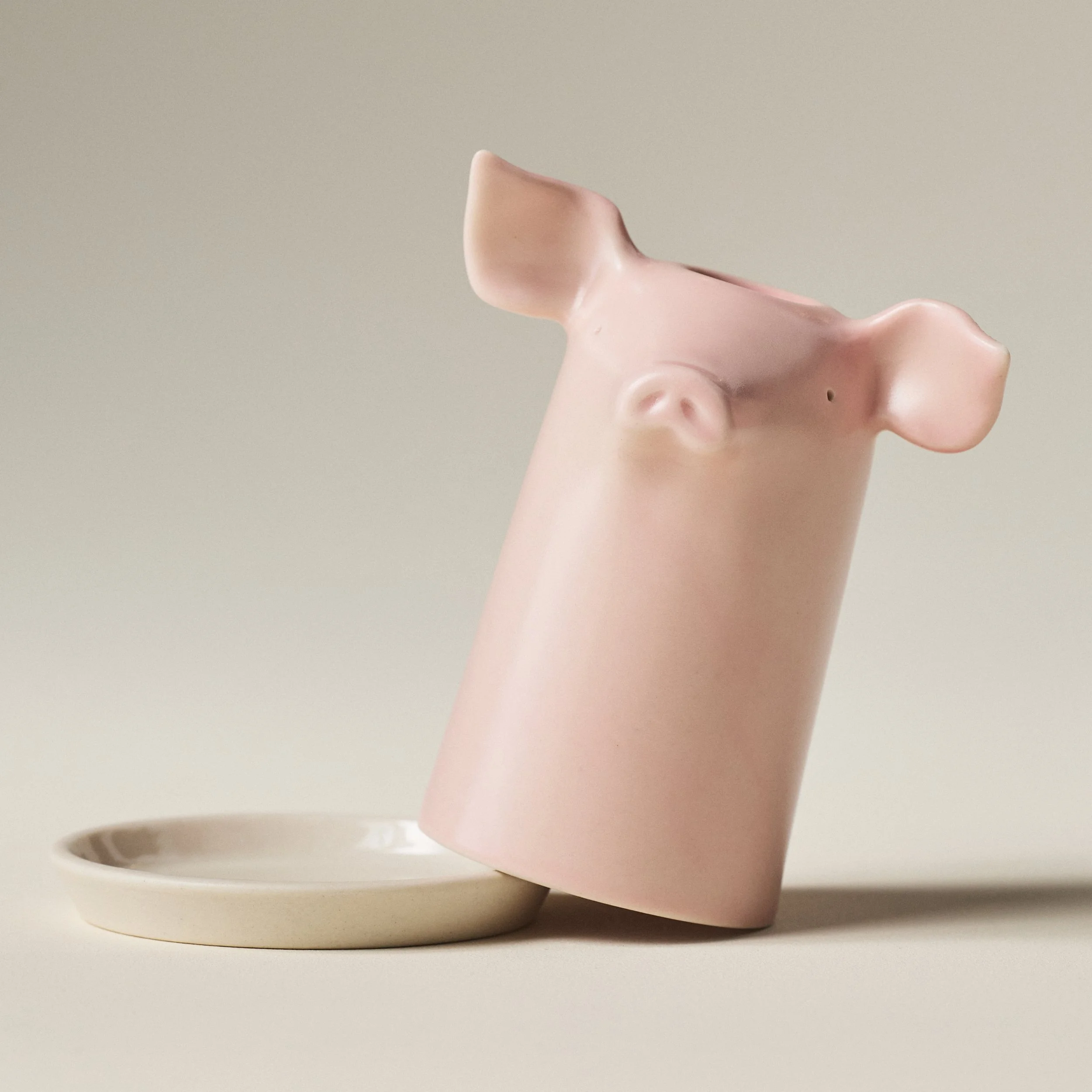 PetitFelts Rose toothbrush holder tipped on its side beside its tray