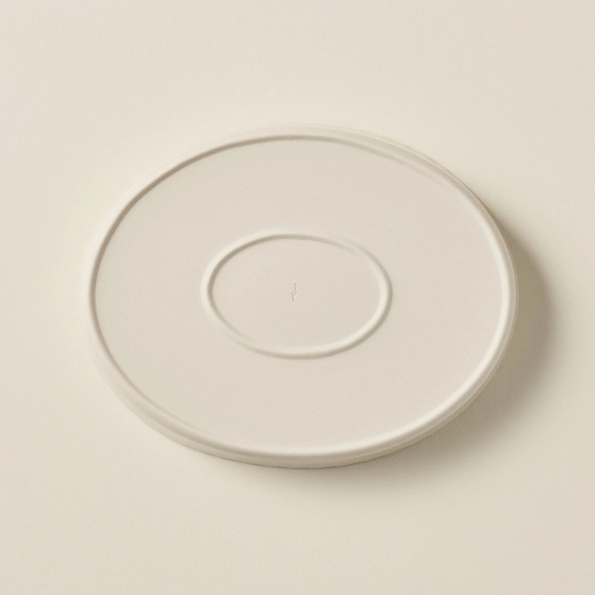 Overhead detail of the PetitFelts Natural ceramic platter