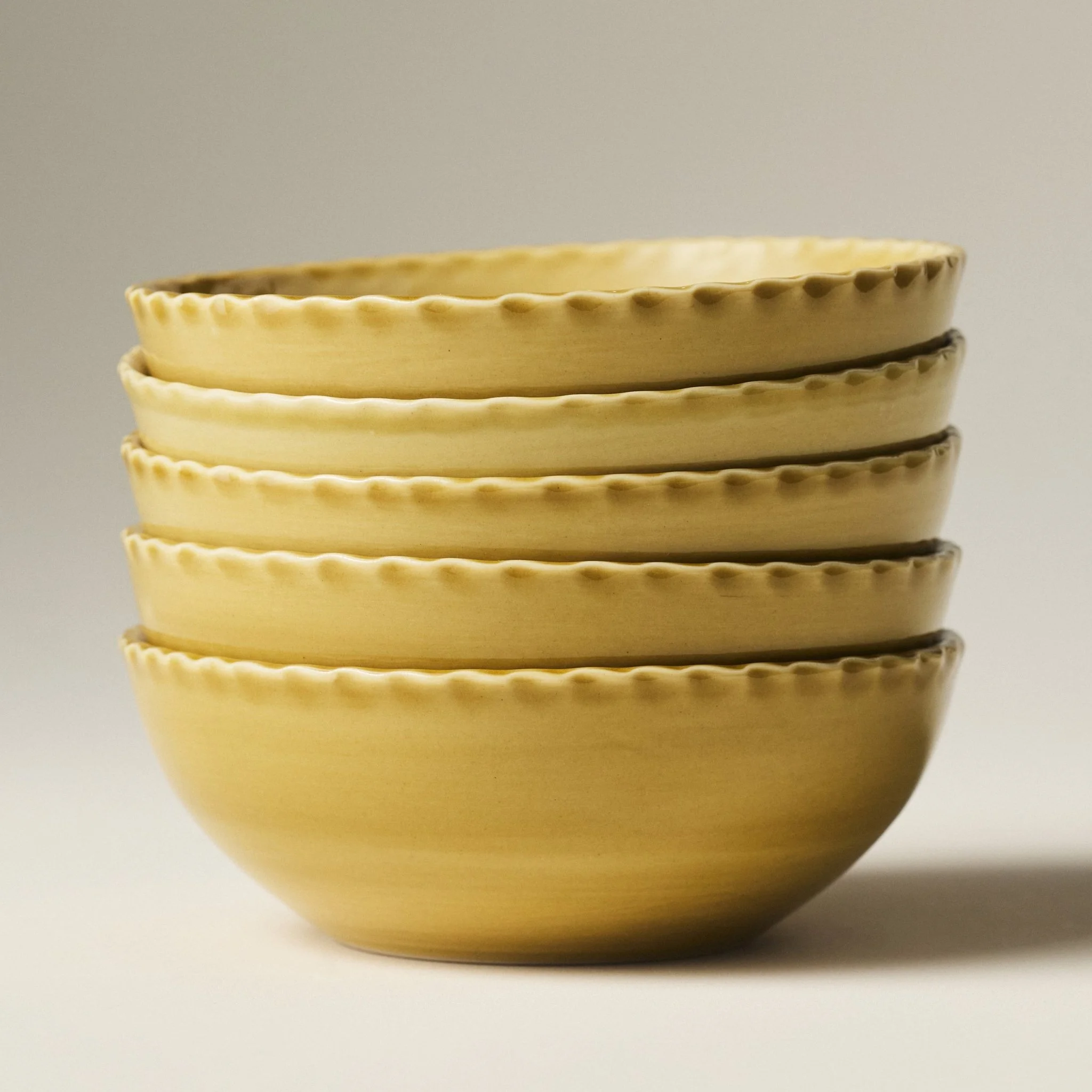 PetitFelts Fennel yellow ceramic soup bowls stacked, showing rim detail and depth