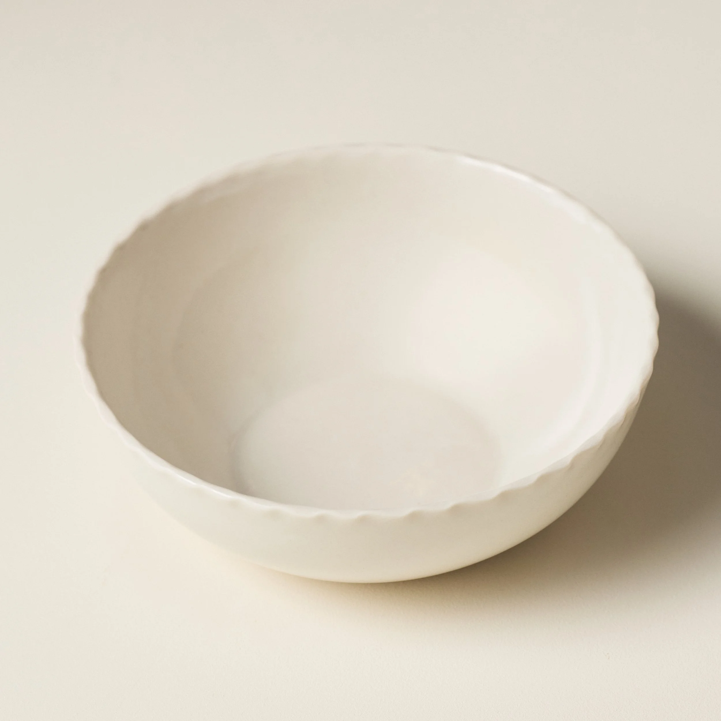 Overhead view of the PetitFelts Natural ceramic soup bowl's glazed interior