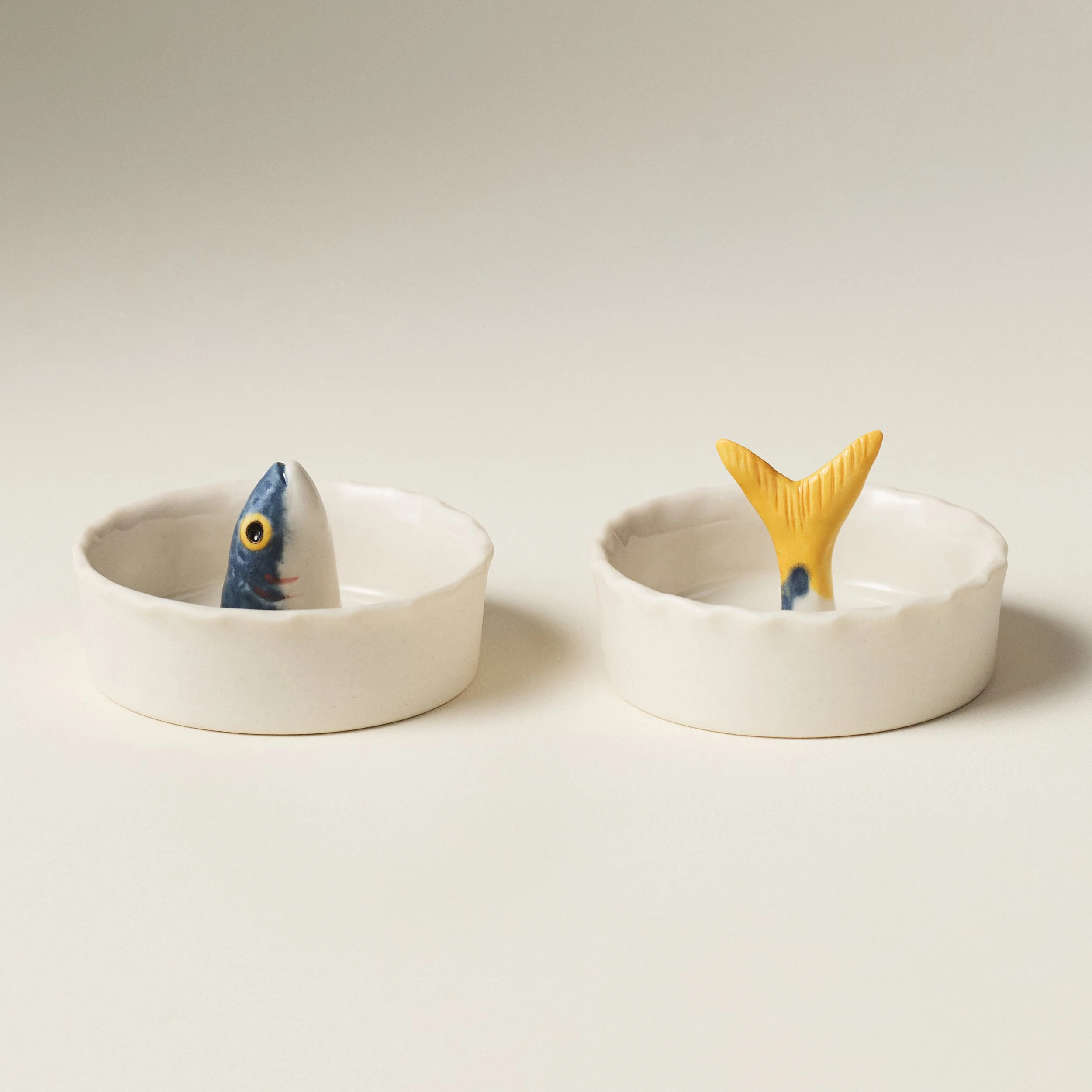 PetitFelts Julian Head and Julian Tail ceramic salt cellars shown together