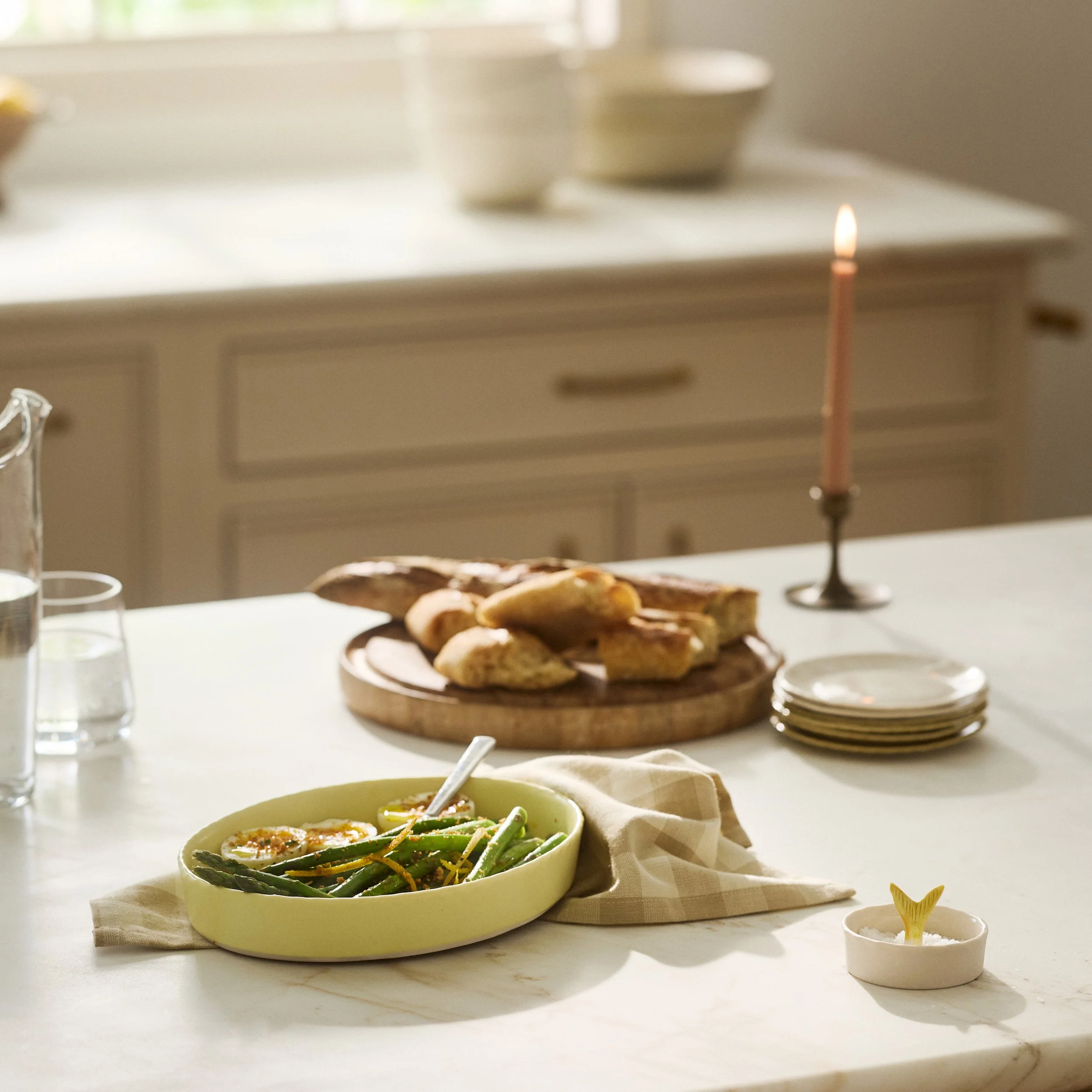 PetitFelts ceramic platters styled on a table with food and a lit candle