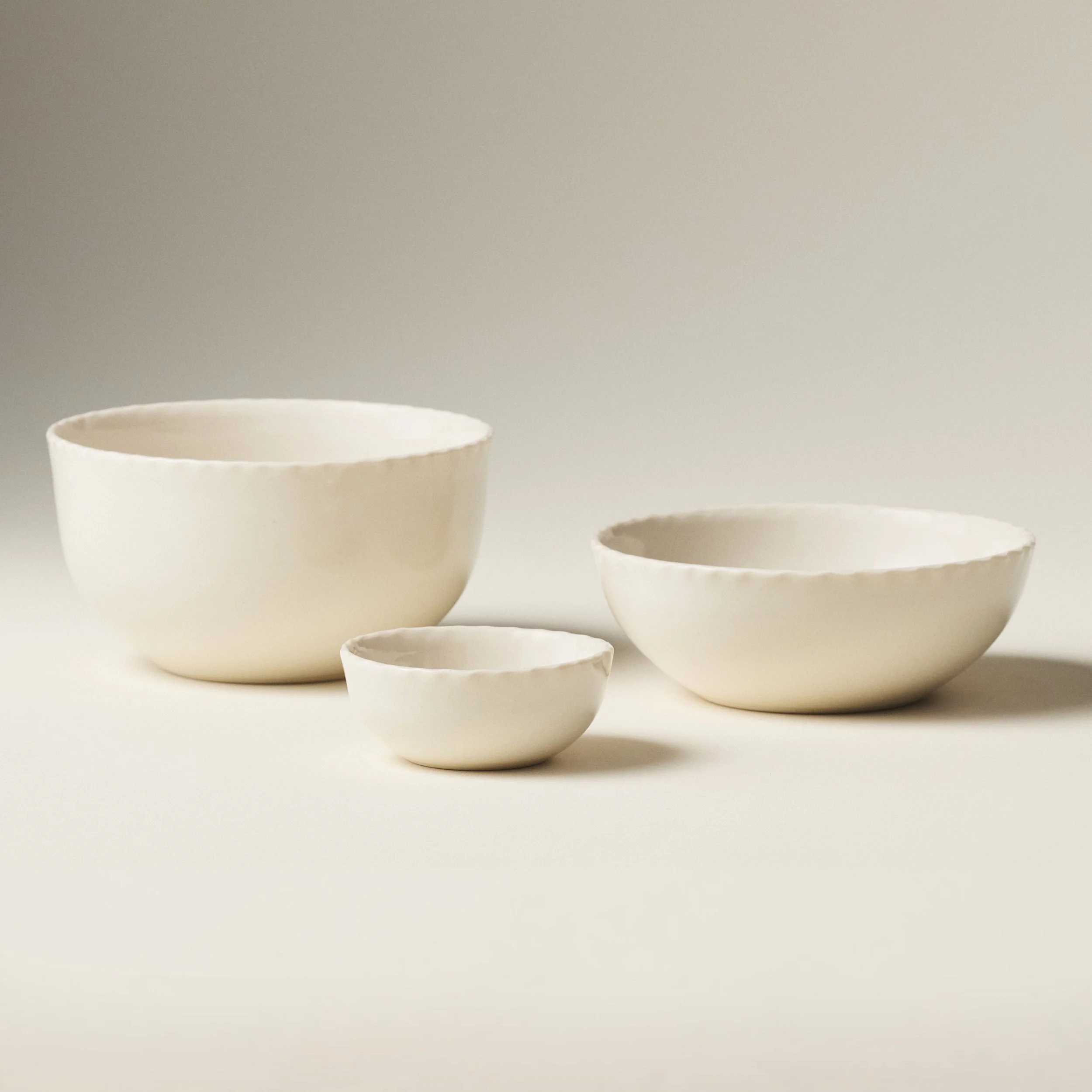 PetitFelts Natural ceramic bowls shown together in Petite, Soup, and Dinner sizes