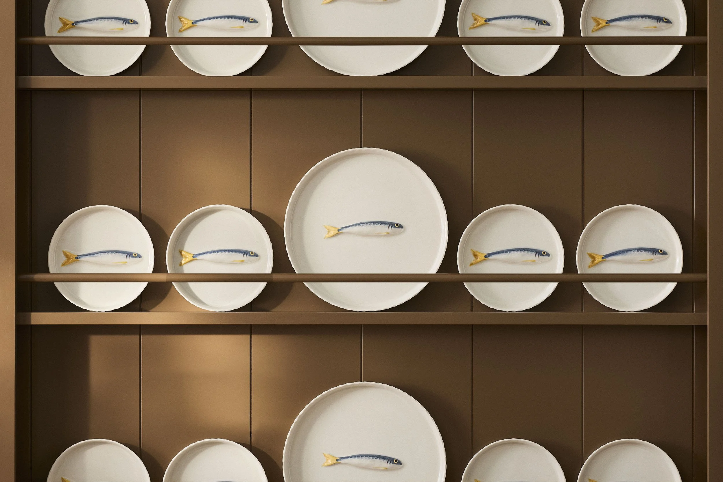 PetitFelts Big and Little Julian Trays Displayed Together on Brown Shelves