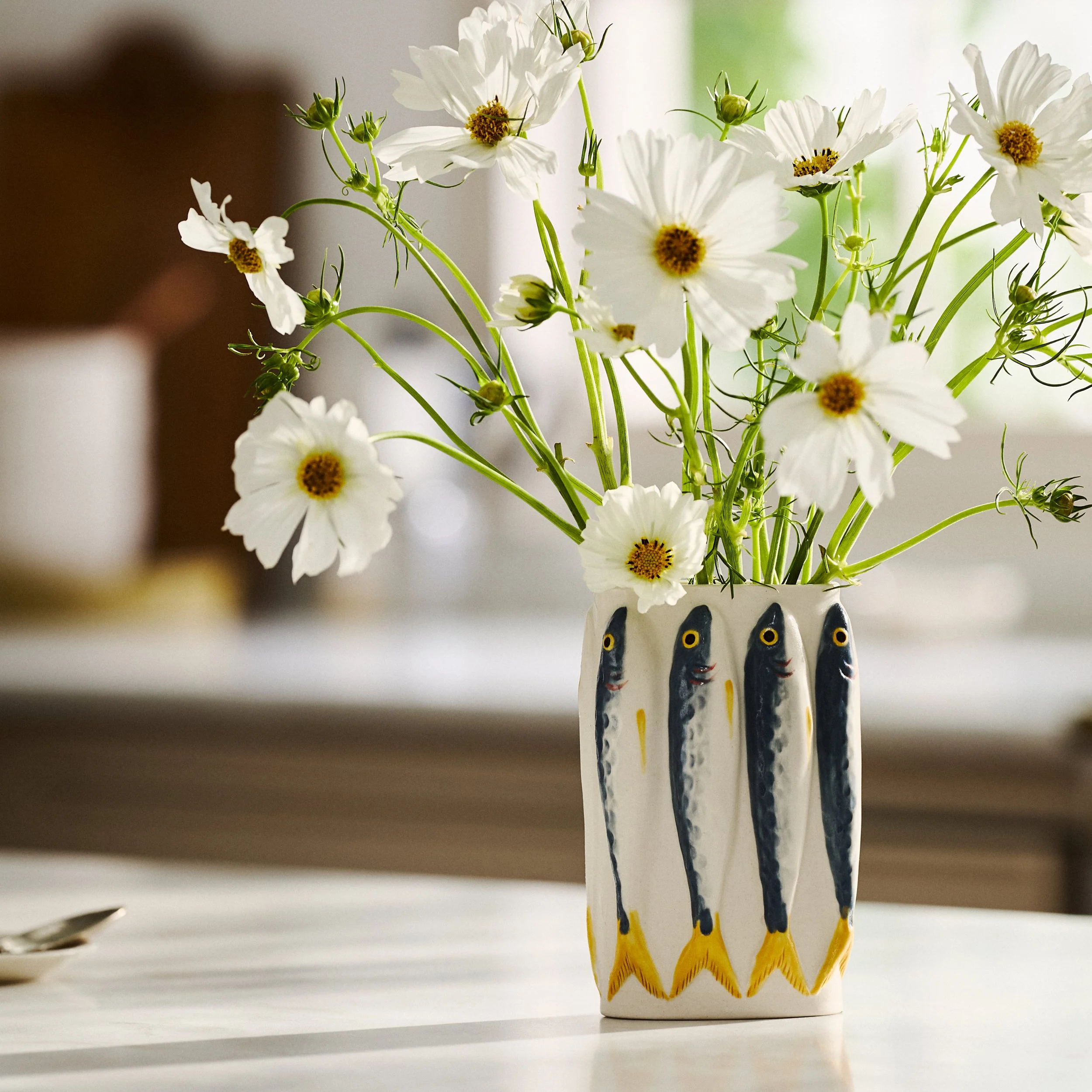 PetitFelts Julian sardine ceramic vase styled with white flowers