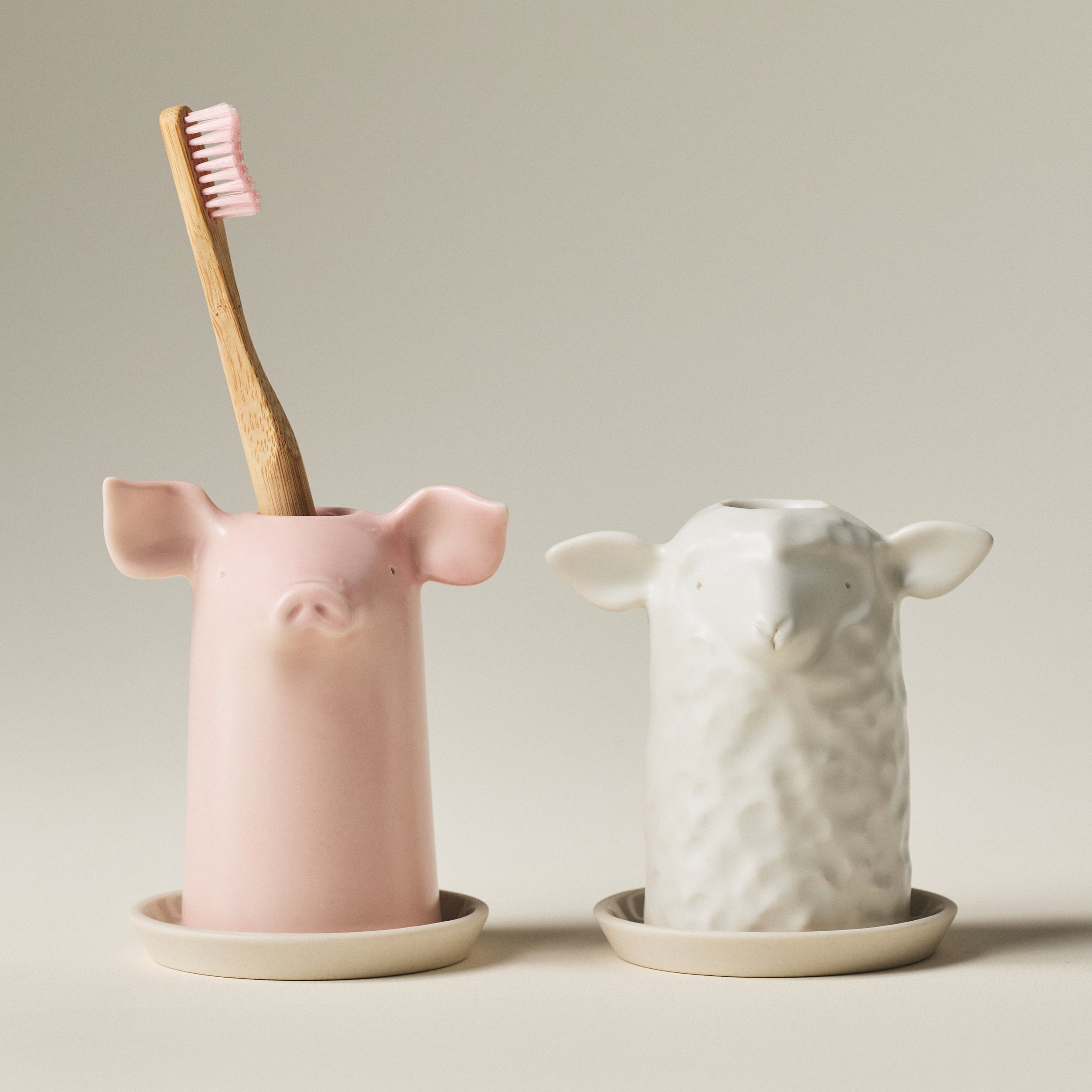 PetitFelts Rose and Herschel toothbrush holders shown side by side