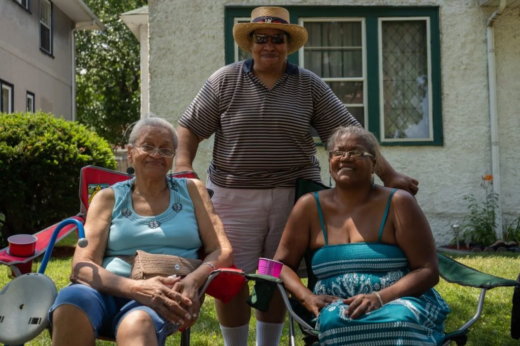 Two generations of Clemmers witnessed jazz in the alley in the ’70s and today. “It’s a part of my history. It’s a part of my community,” said Eve Clemmer, center, who is in between her mom and sister.