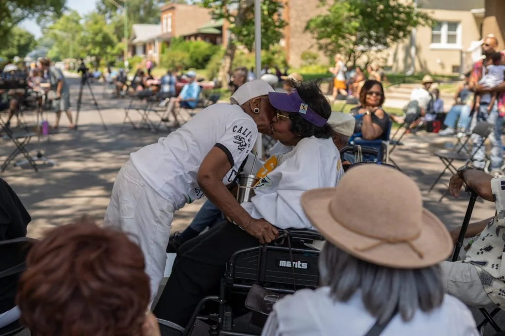 Friends greet each other at Back Alley Jazz Fest in South Shore.