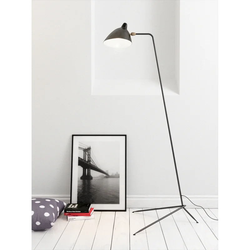 1 arm floor lamp from Serge Mouille.