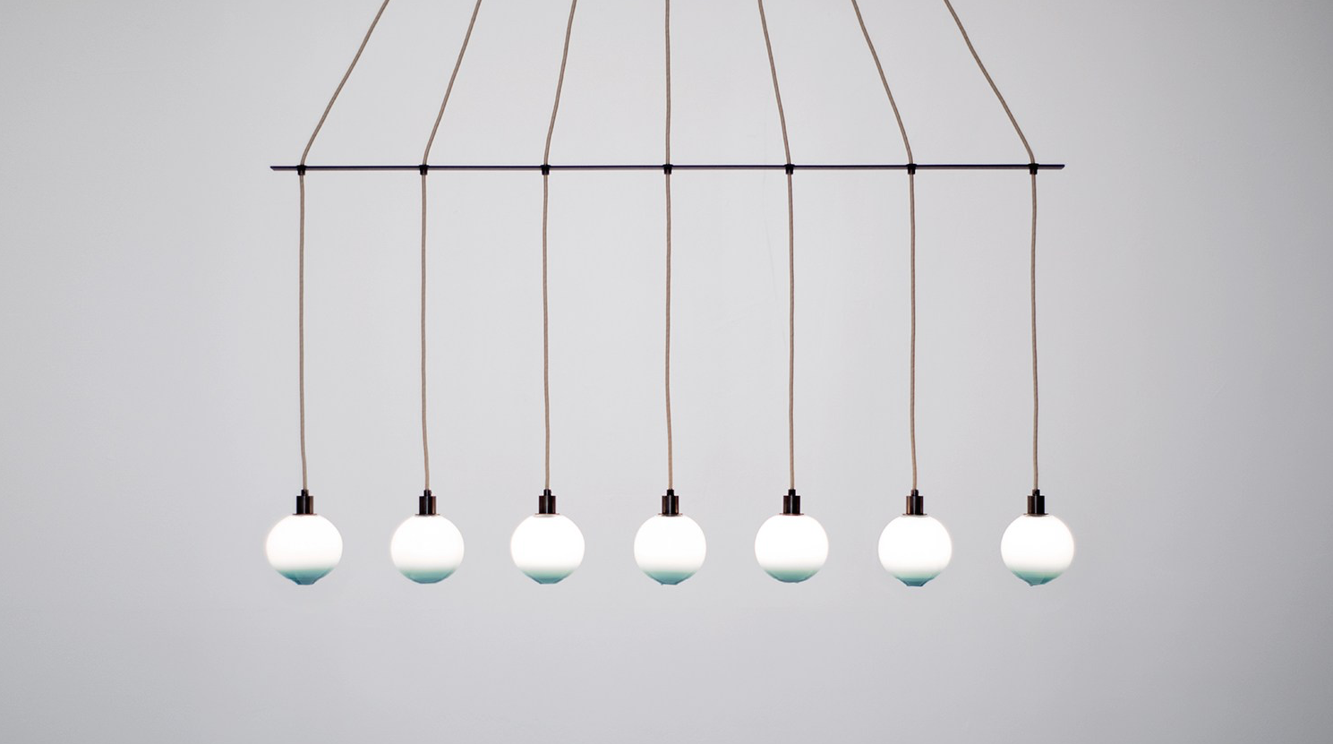 Drape Linear 7 Chandelier in Dark Oxidized or Brushed Brass finish